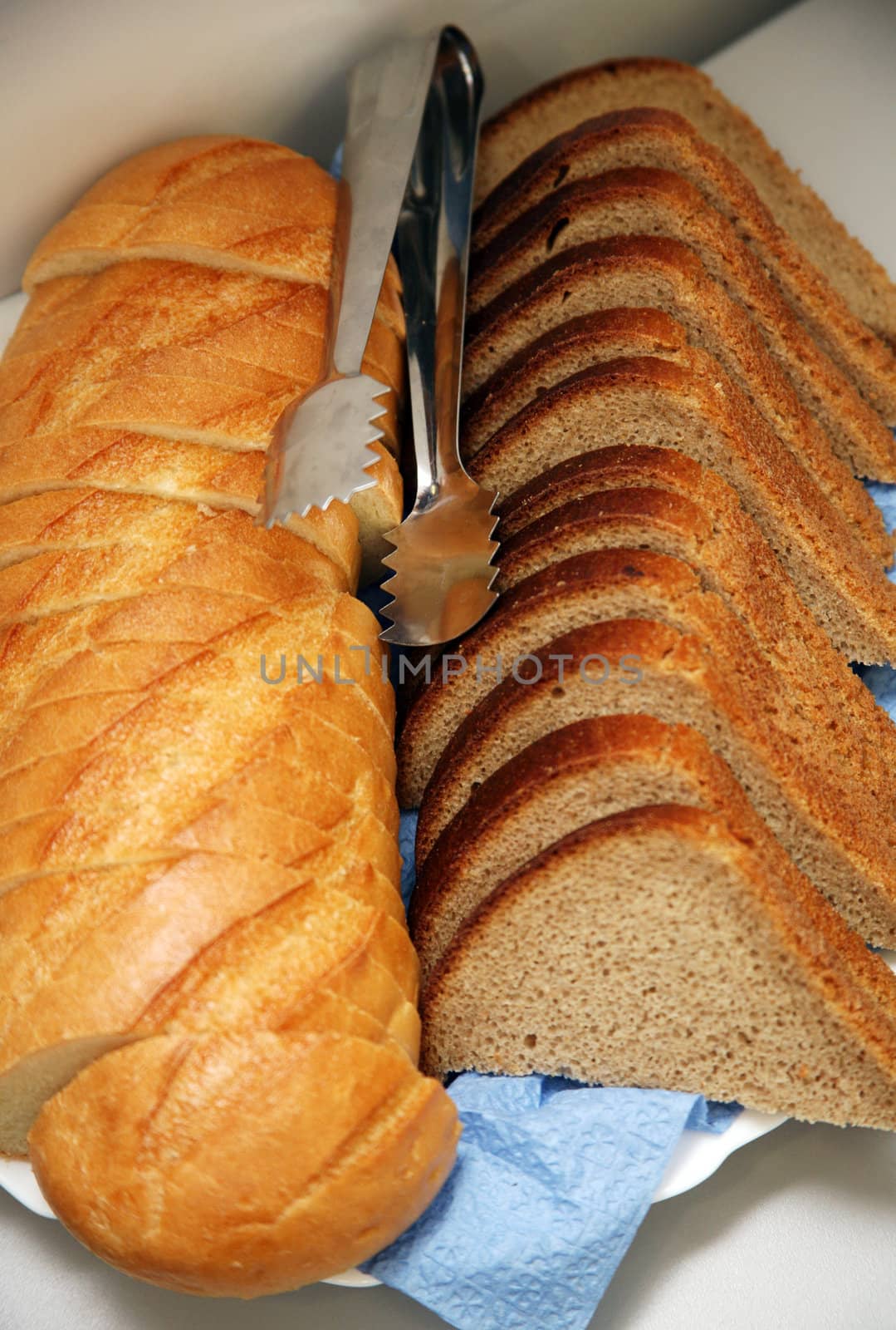 Different kind of bread with a metal nipper