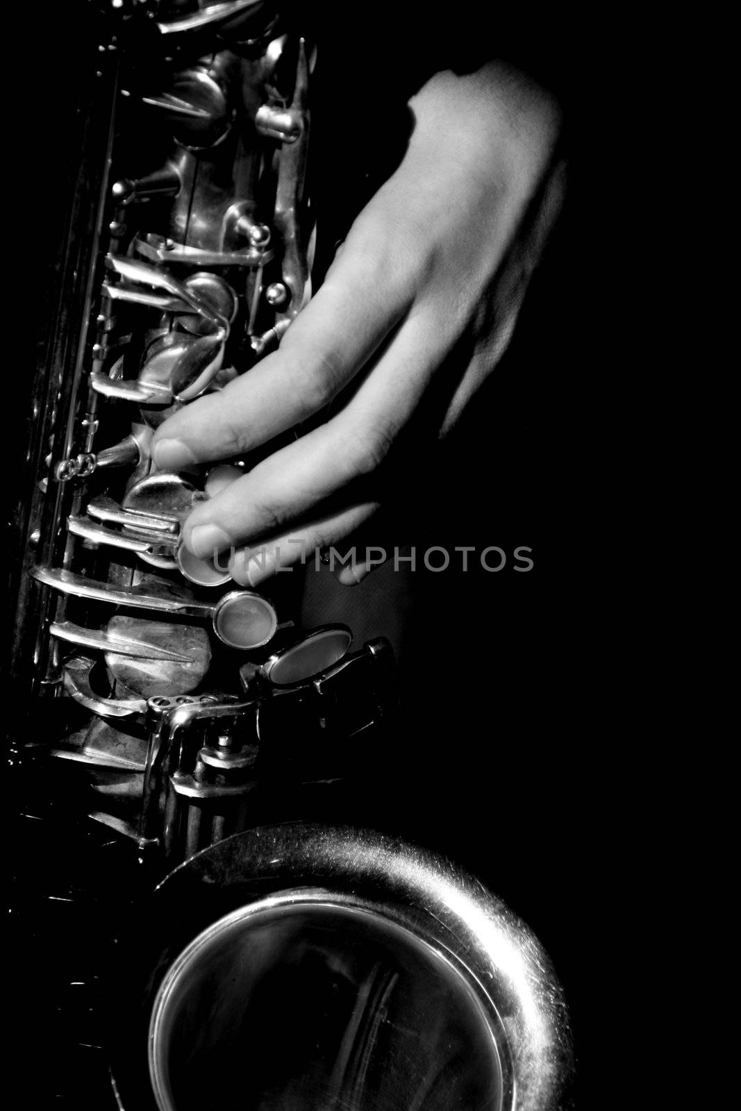 hands of musicinan playing Saxophone