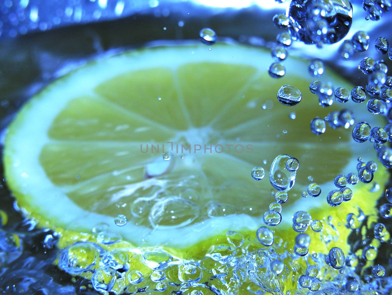 half lemon in water by kjpargeter