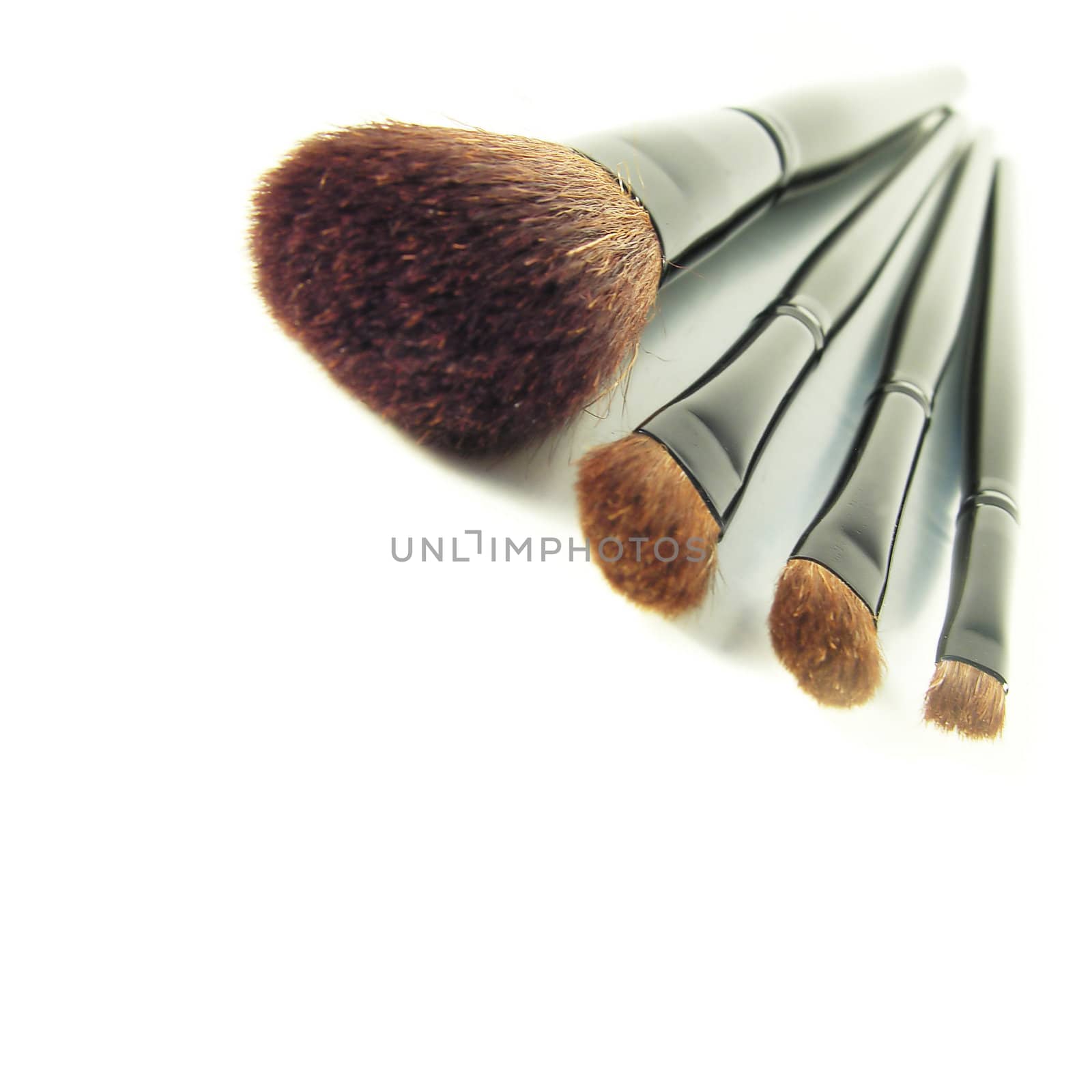 cosmetic brushes isolated in white