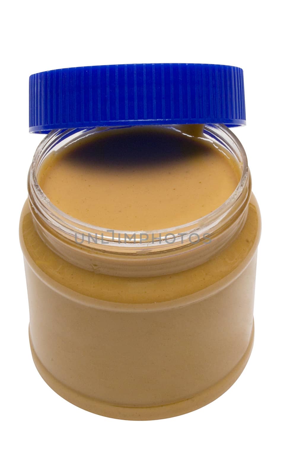 Open glass of peanut butter isolated on a white background. File contains clipping path.