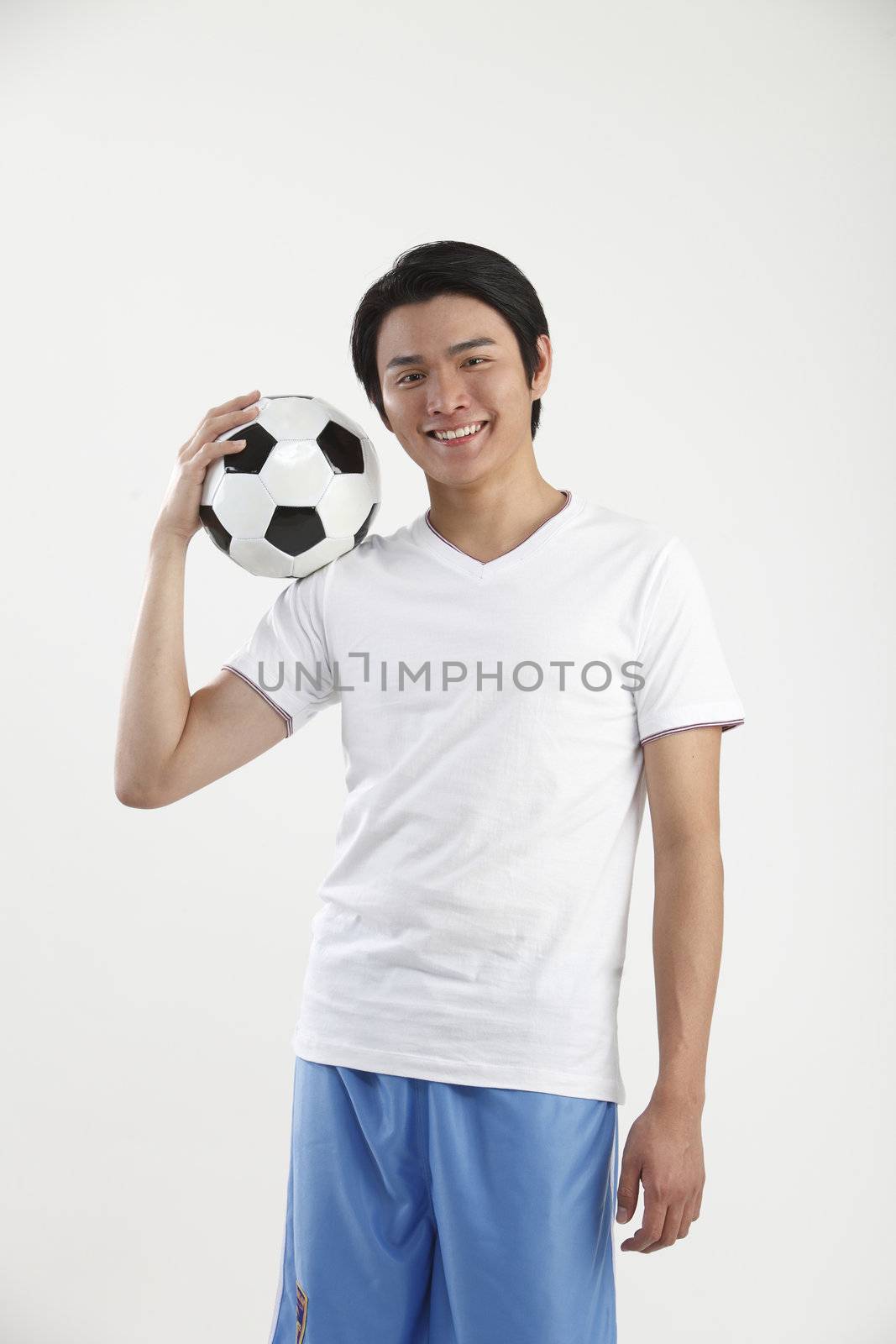 young man holding a football