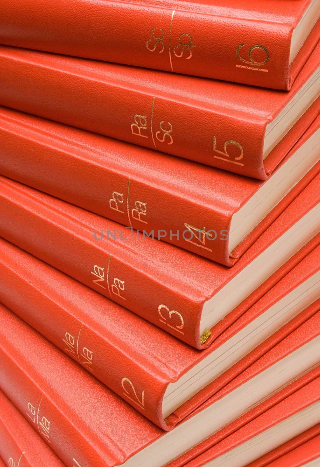 Stack of red textbooks.