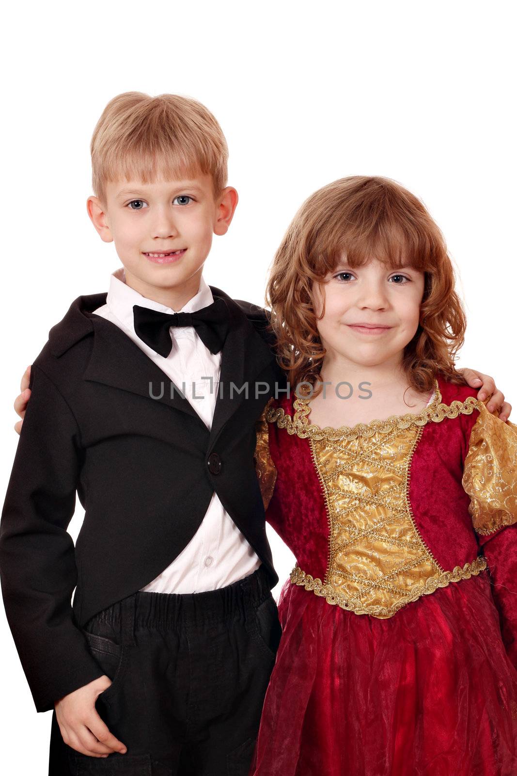 boy in tuxedo and little girl in golden red dress portrait by goce