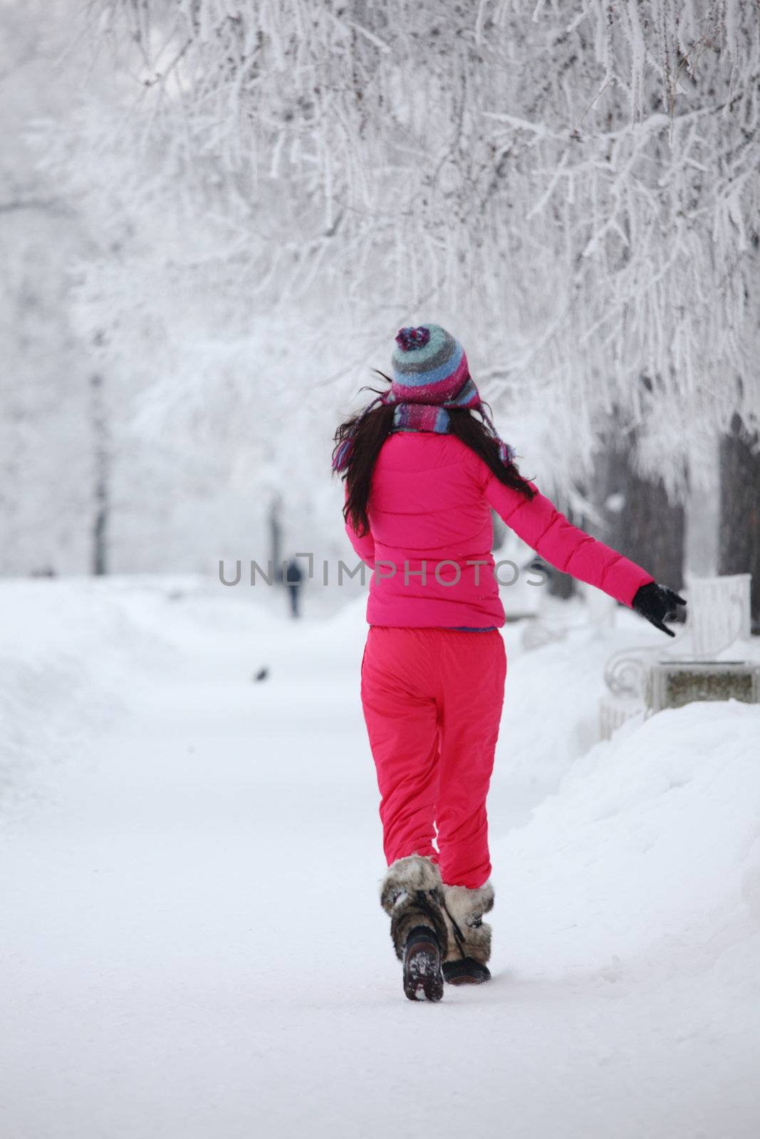 woman run in winter park very happy