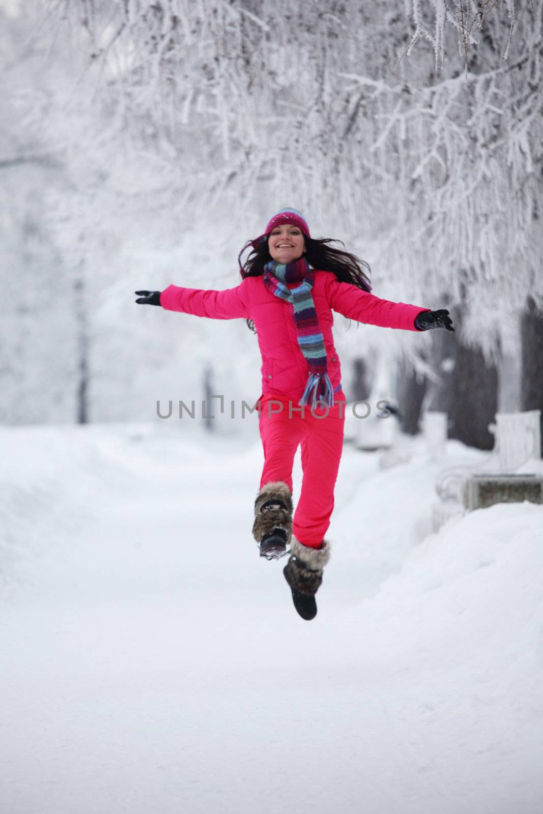 woman run in winter park very happy