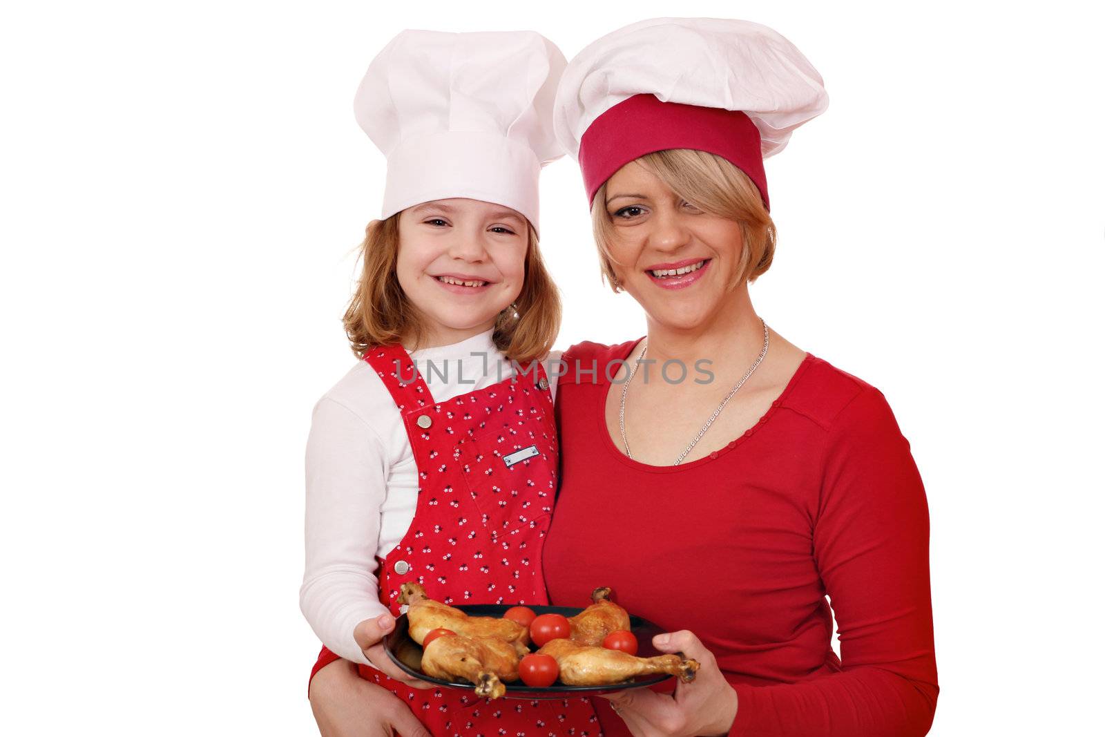 mother and daughter cook with chicken drumstick by goce