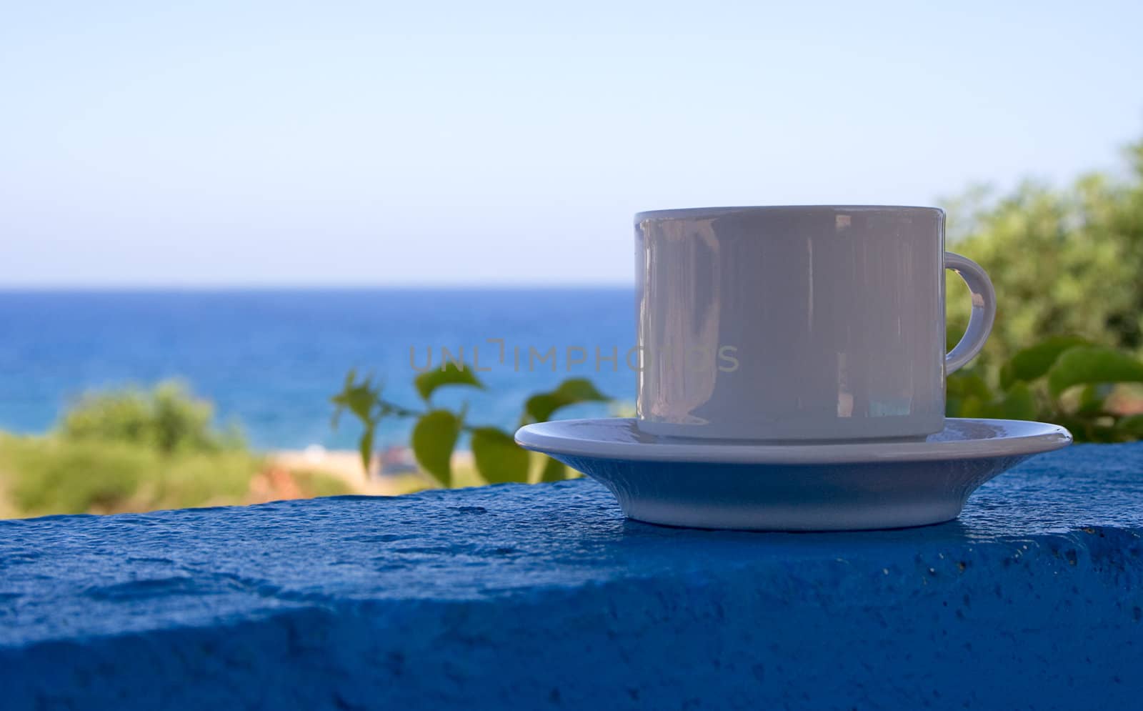 Cup of coffee at the beach.