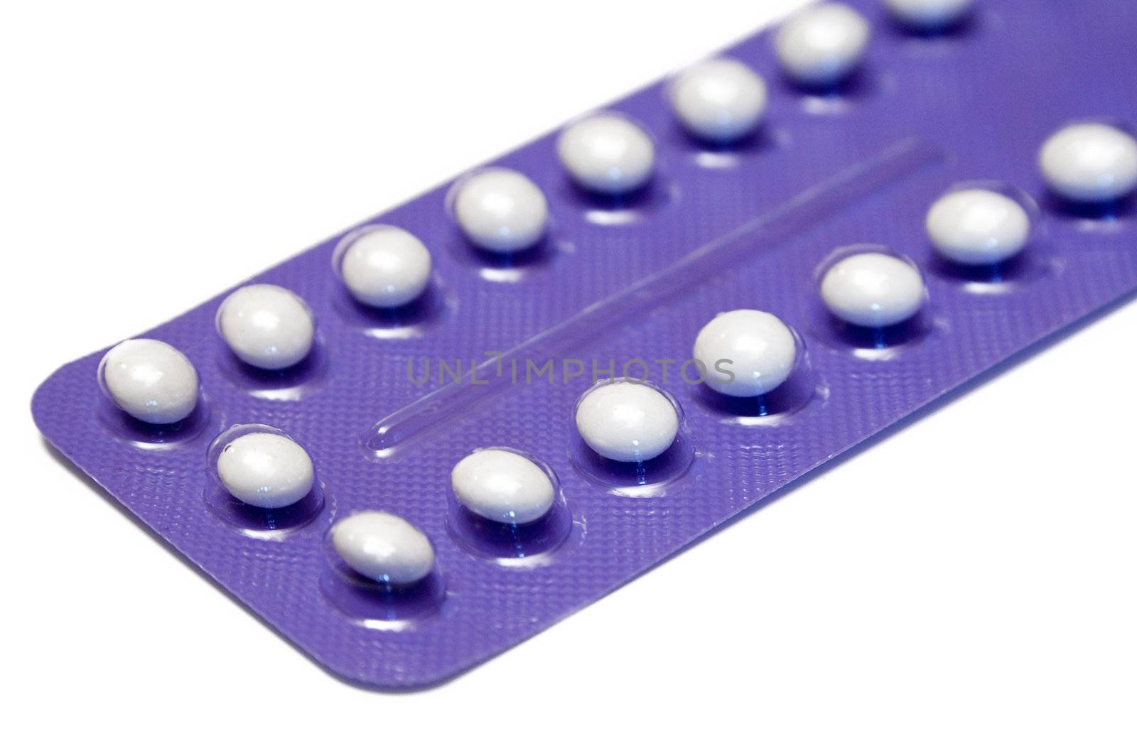 Blister pack of birth control pills isolated on a white background.