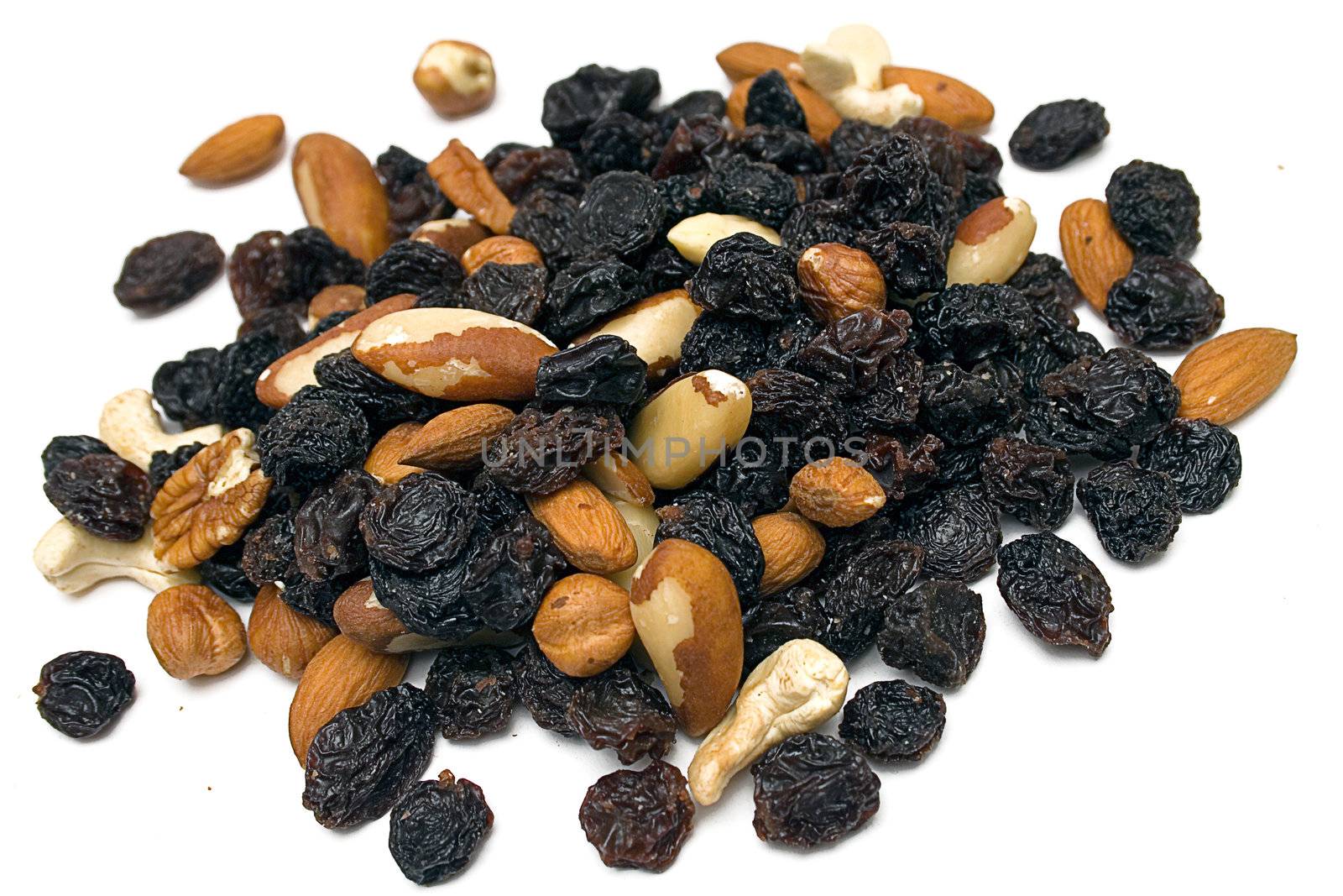 Pile of nuts and raisins isolated on a white background.
