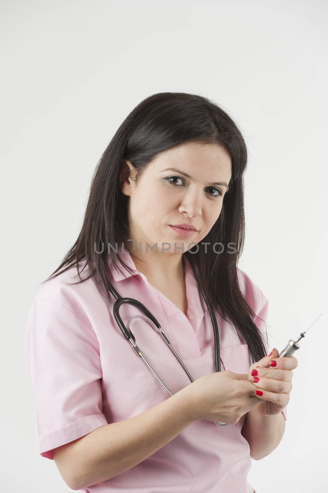 Nurse with stethoscope ready for injection