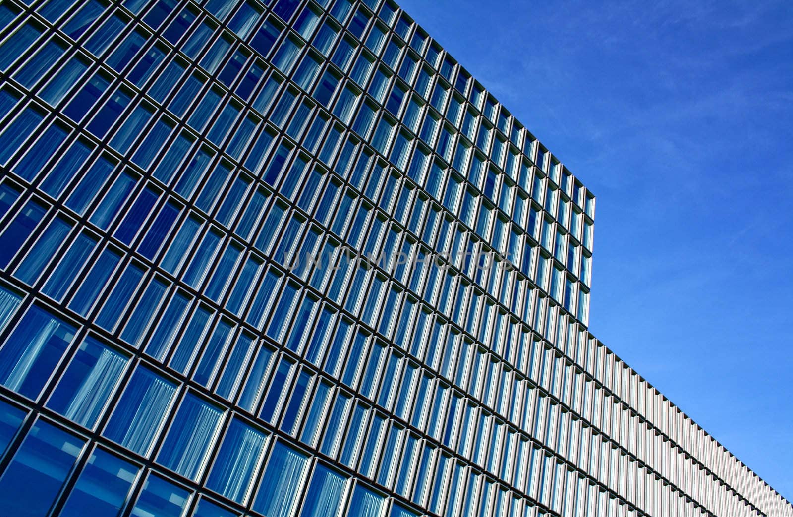 Modern architecture formed in a building reflecting blue sky