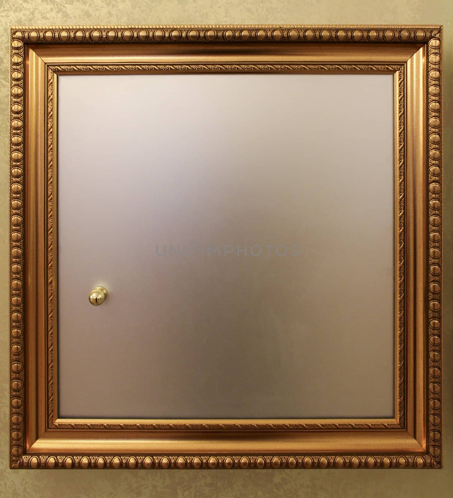 Door from in-wall safe with a golden frame 