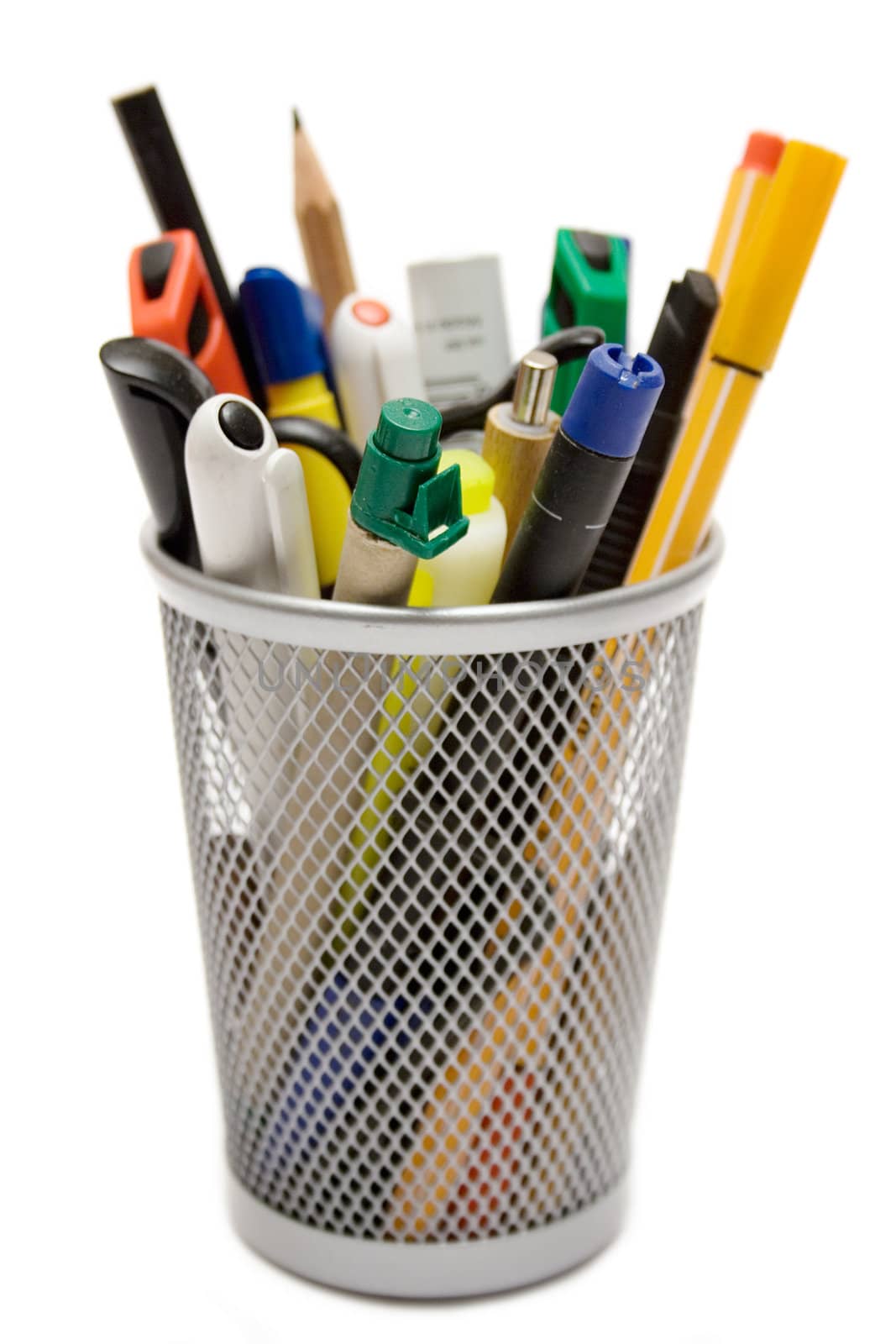 Collection of writing instruments in a metal wire mug. Isolated on a white background.