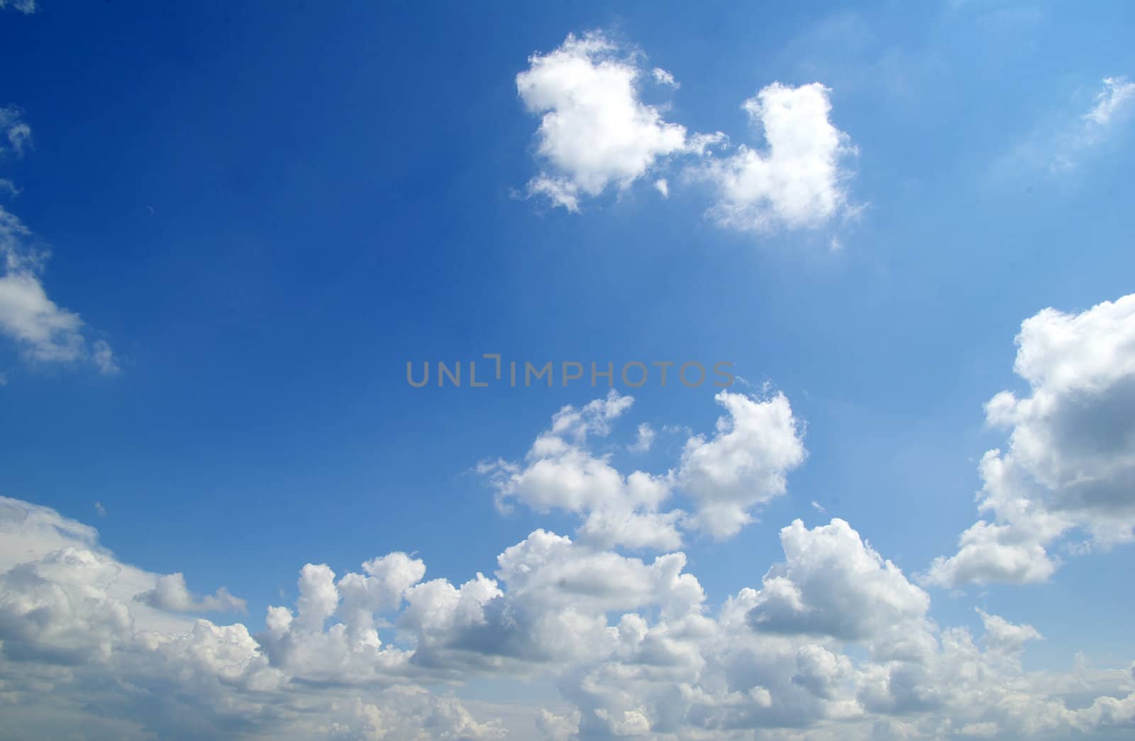 blue sky background with tiny clouds