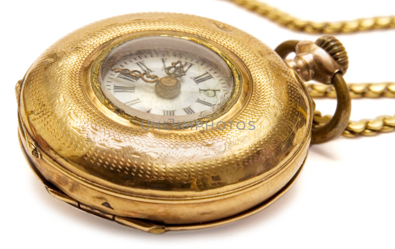 Old-fashioned golden pocket watch isolated on a white background.