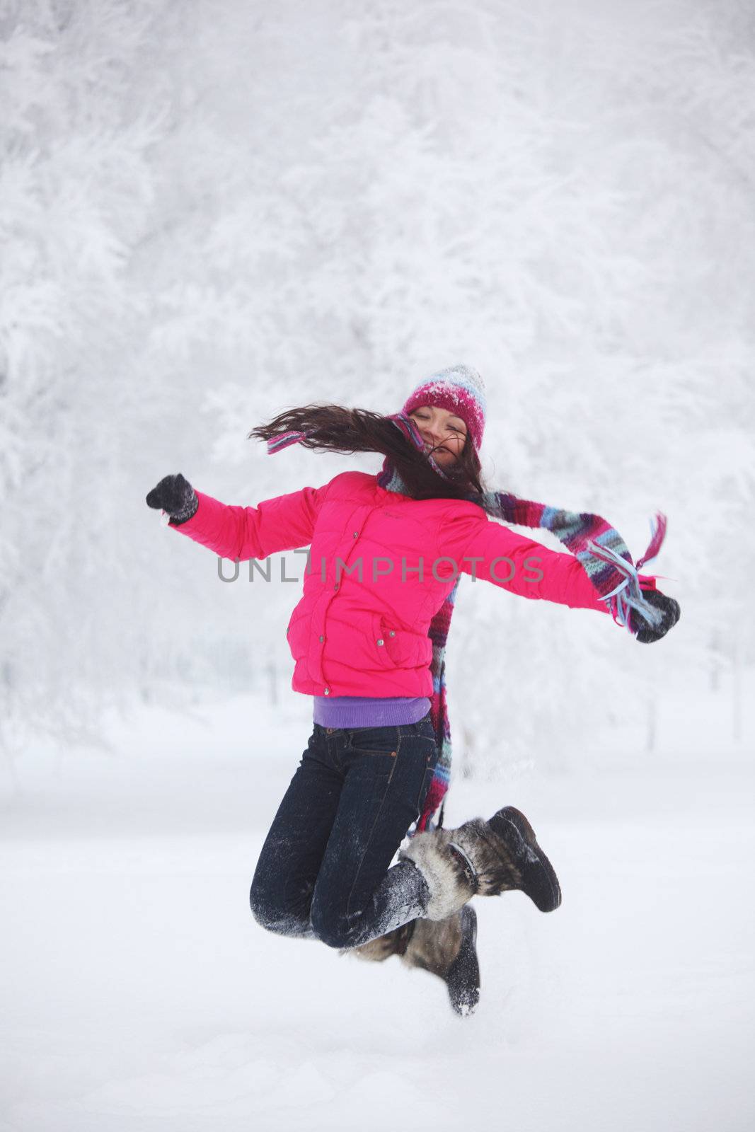 winter women jump in snow