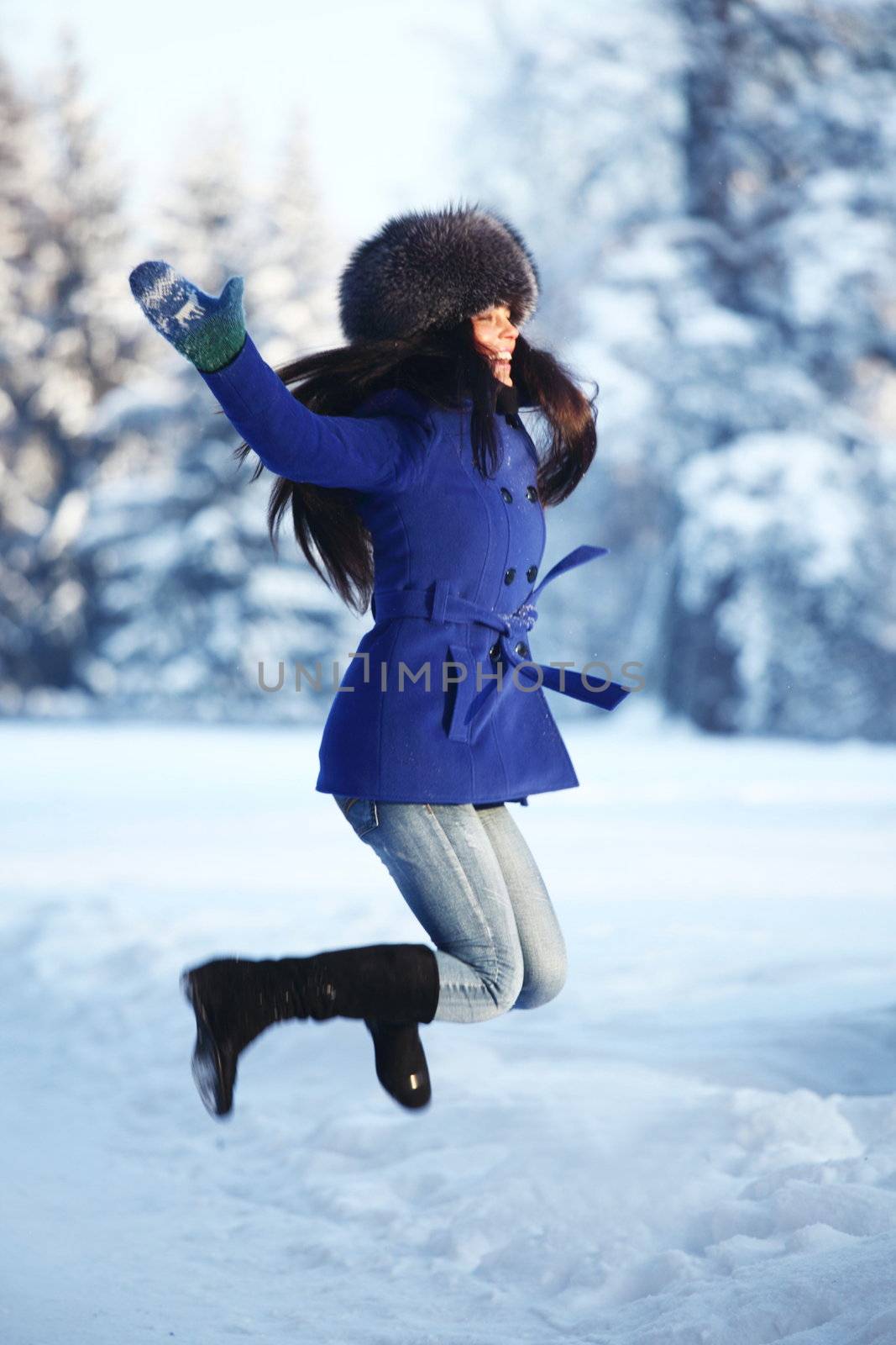 winter women jump in snow