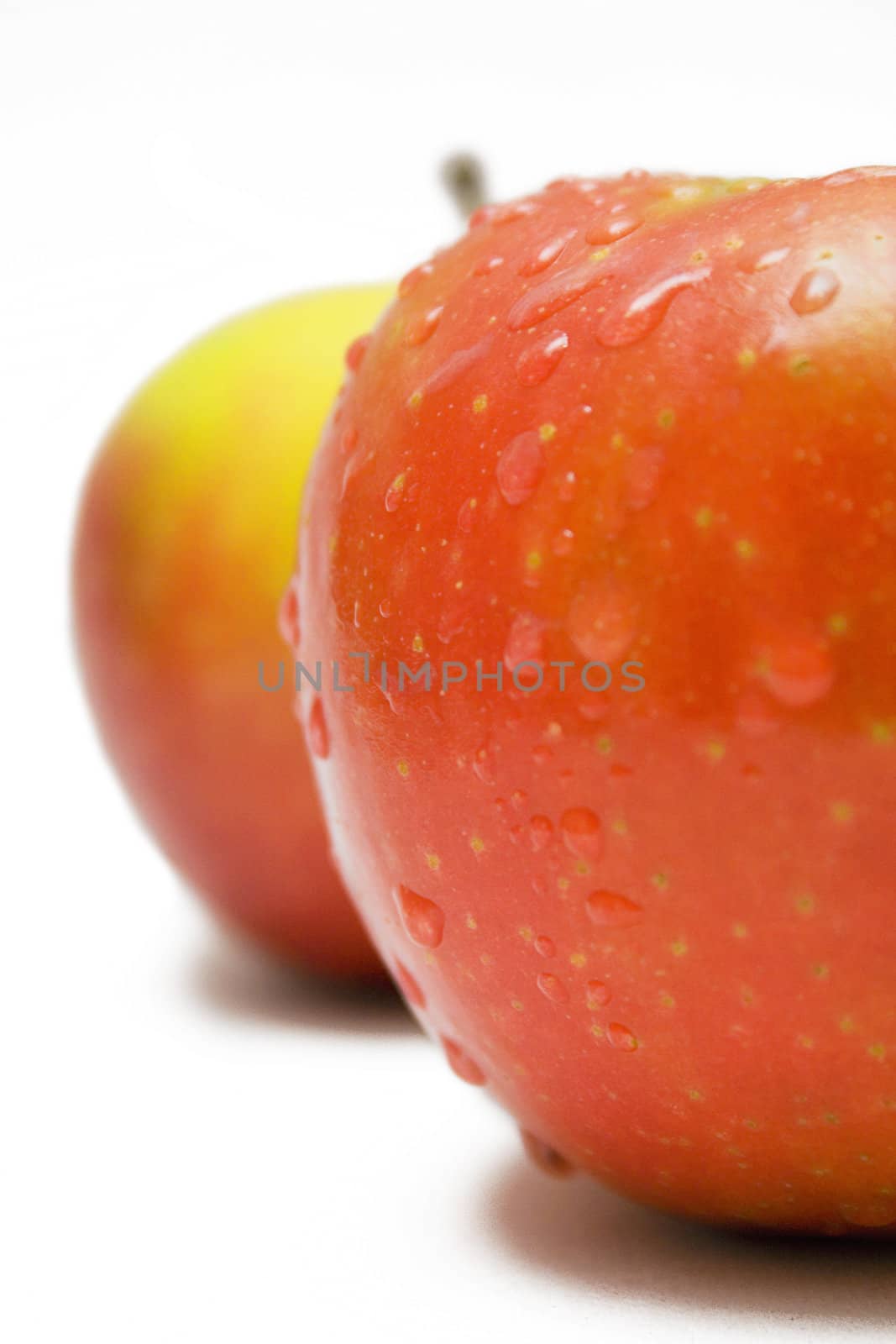 Apples with raindrops isolated on a white background.
