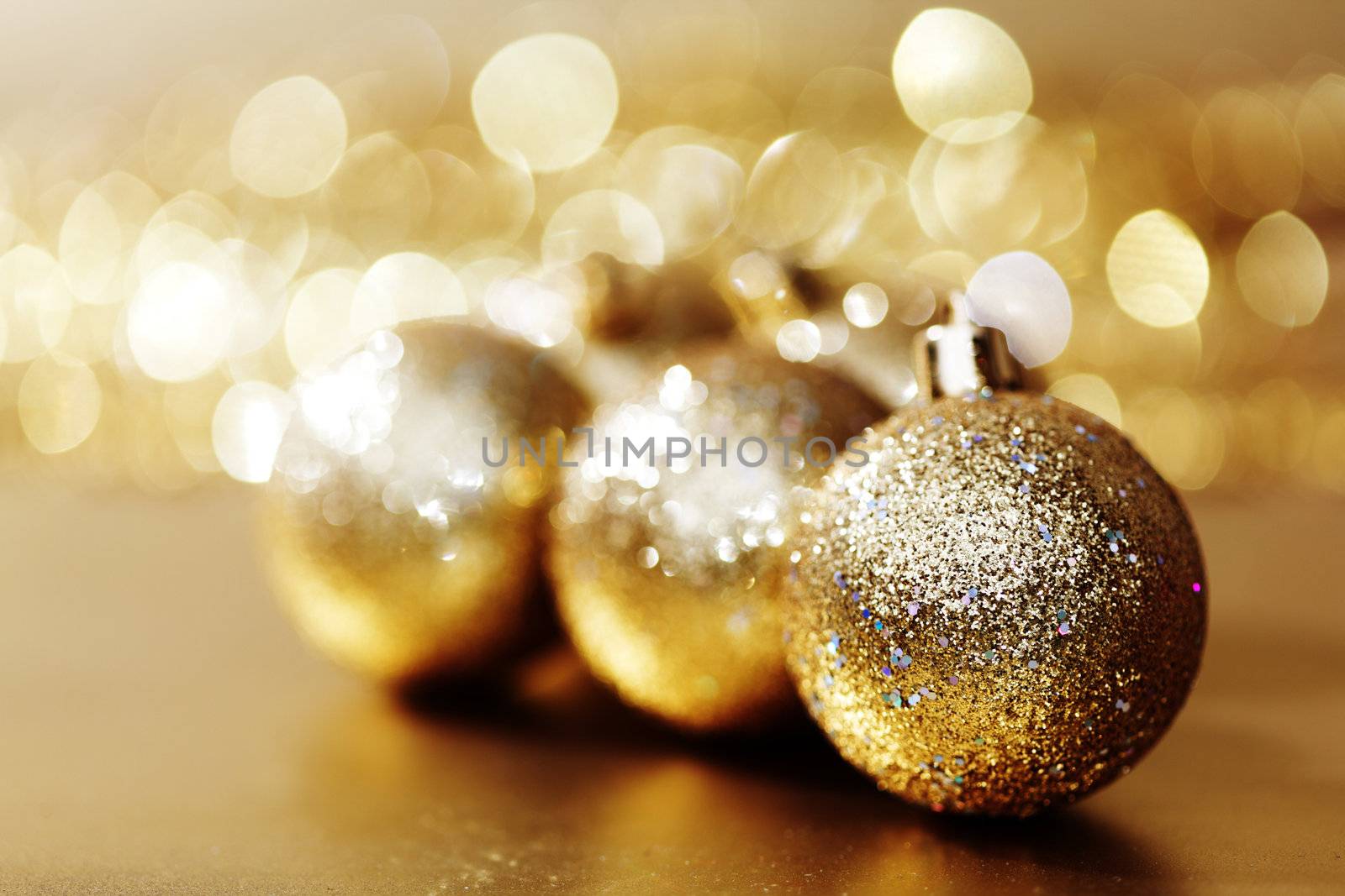 golden christmas ball on golden bokeh background