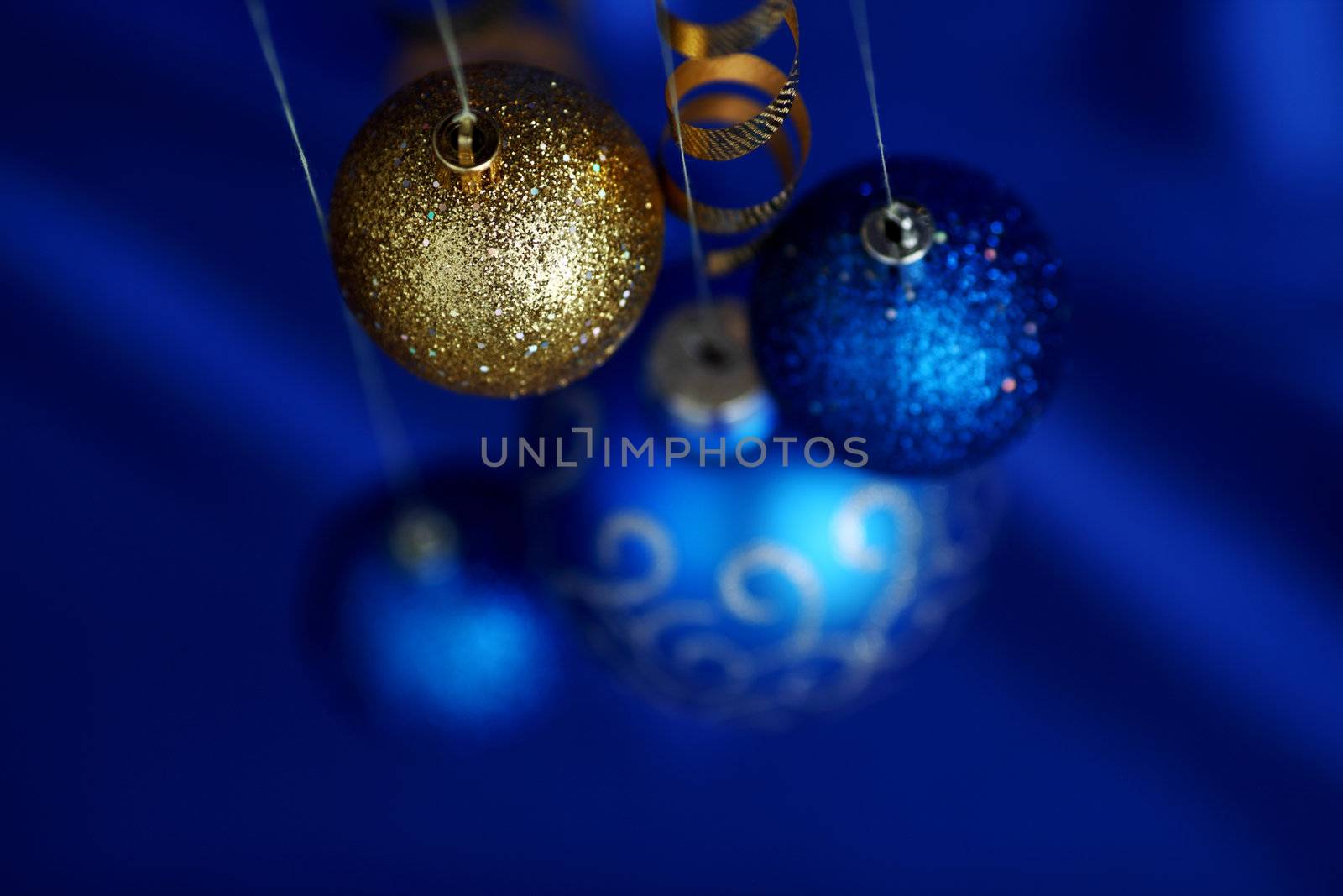 christmas balls on blue satin background