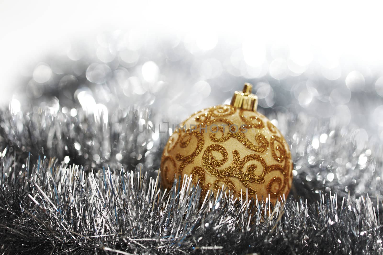  golden christmas ball on silver background
