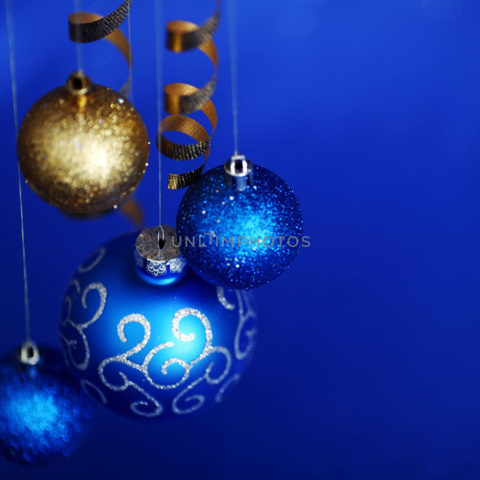 christmas balls on blue satin background