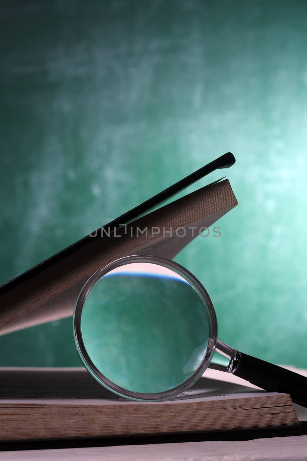 magnifier resting on the open page book