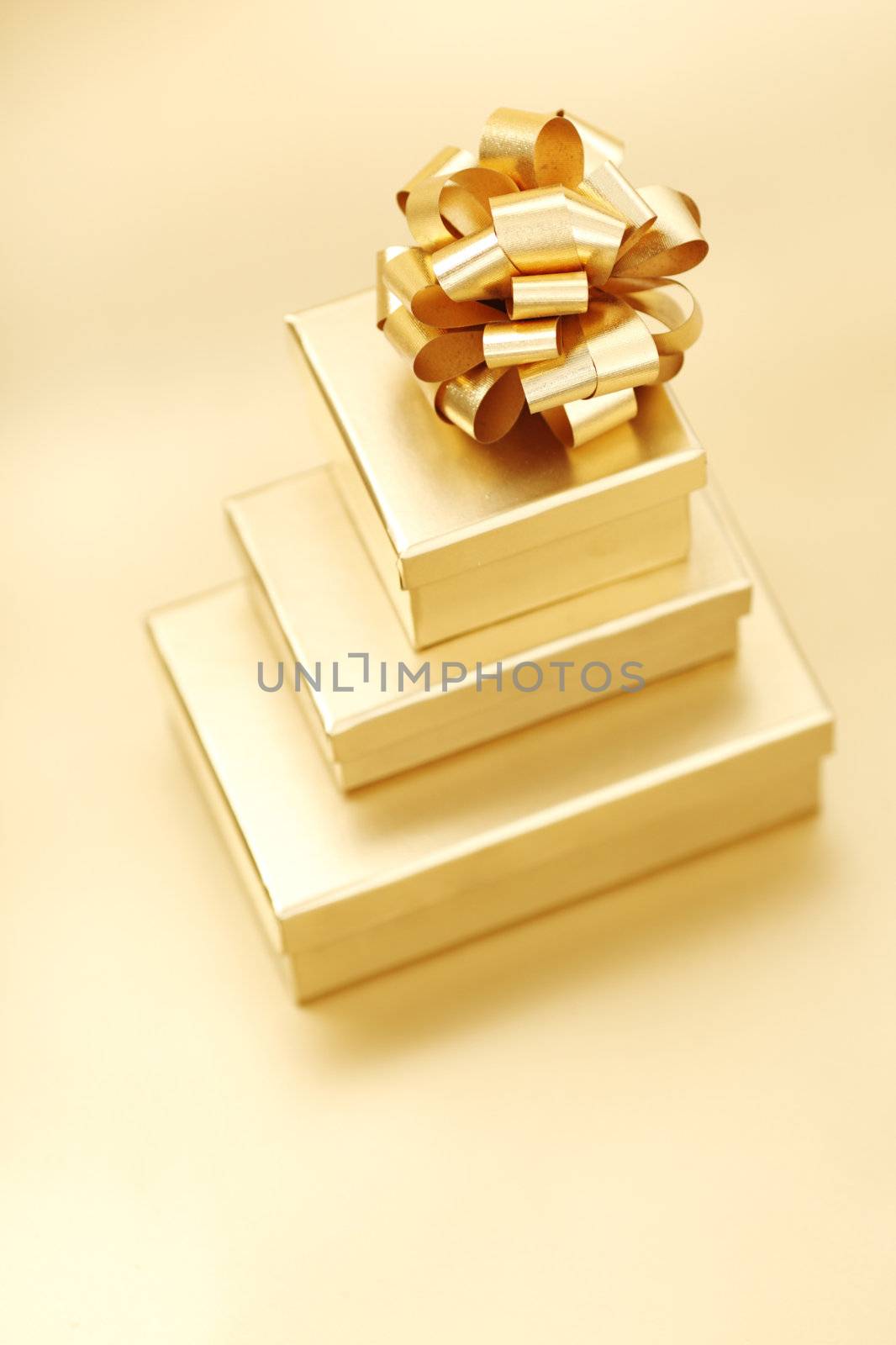 golden christmas gifts on gold background 