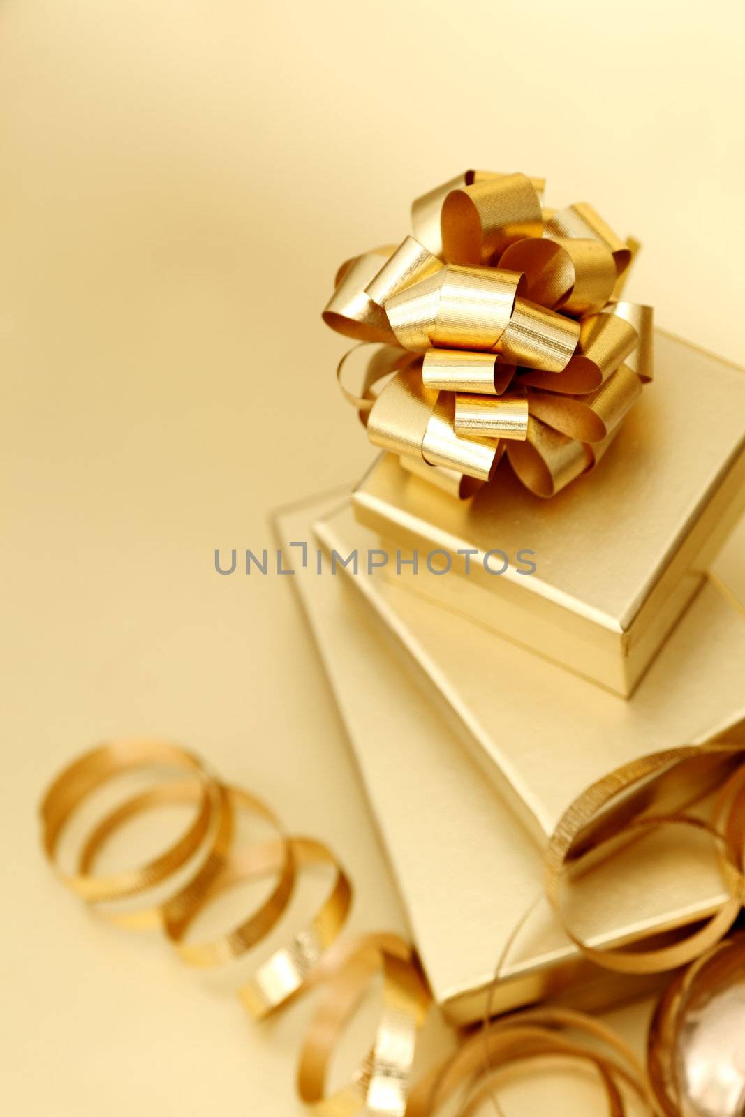 golden christmas gifts on gold background 