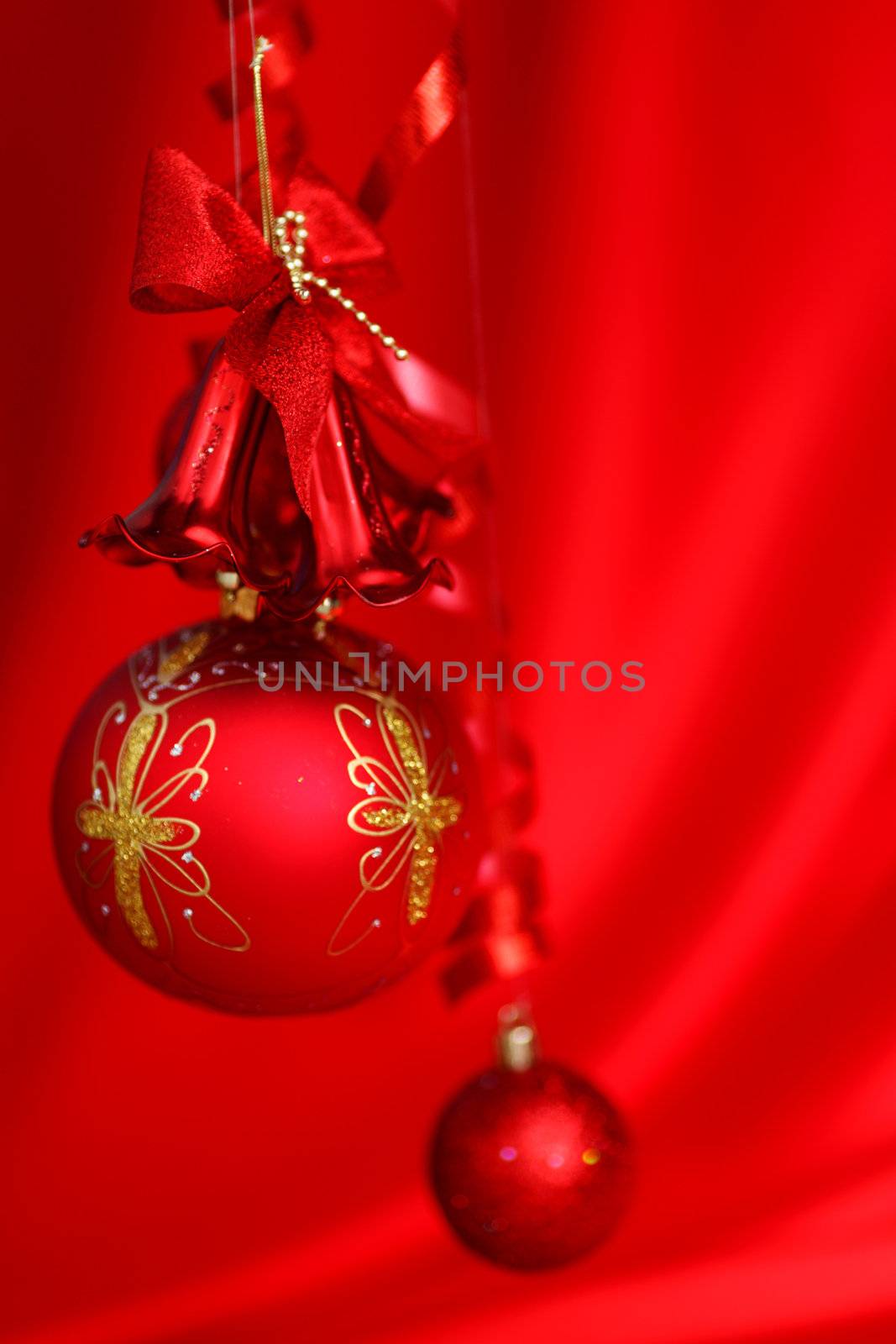  christmas balls on red satin background