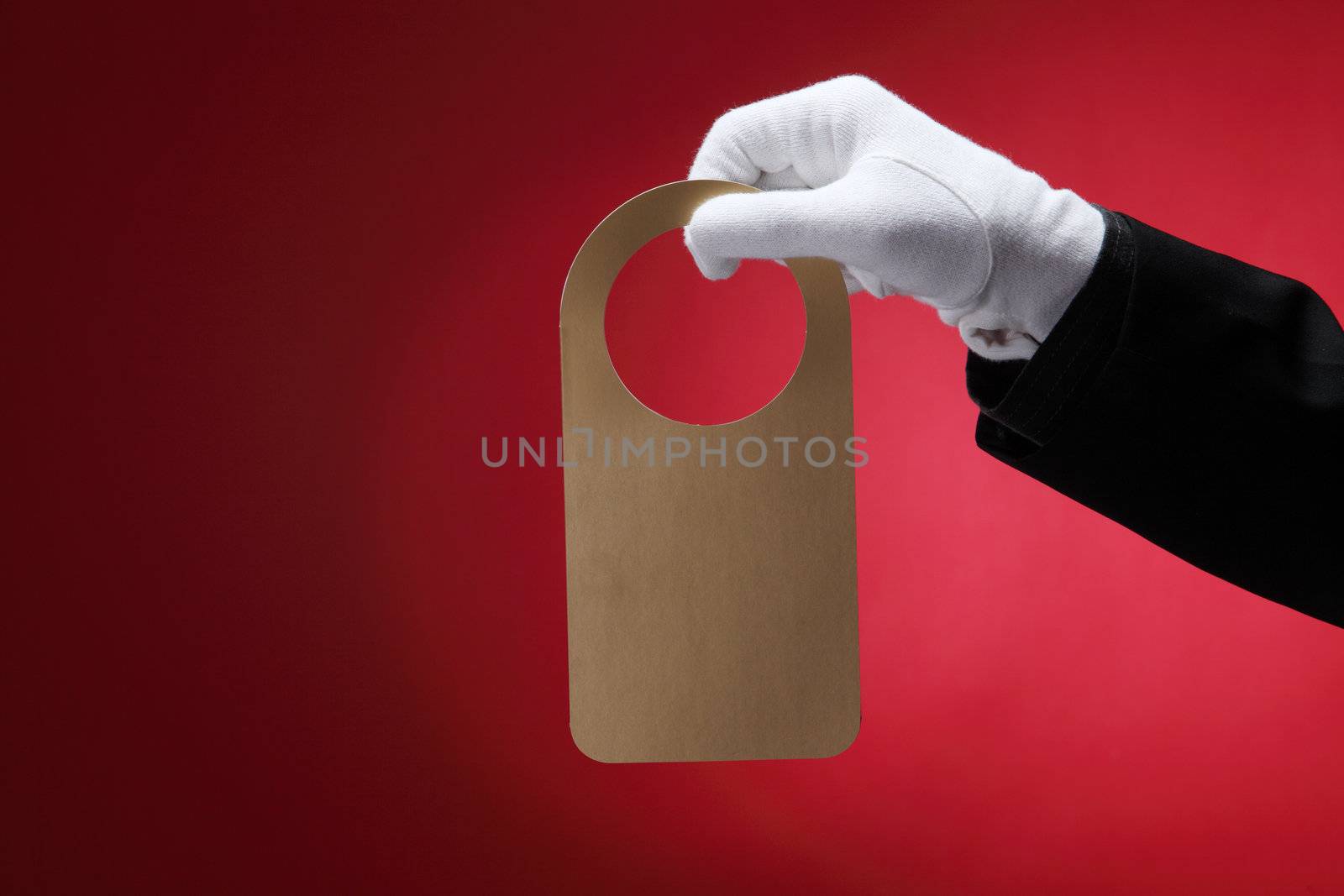  close up of the hotel staff holding a door sign