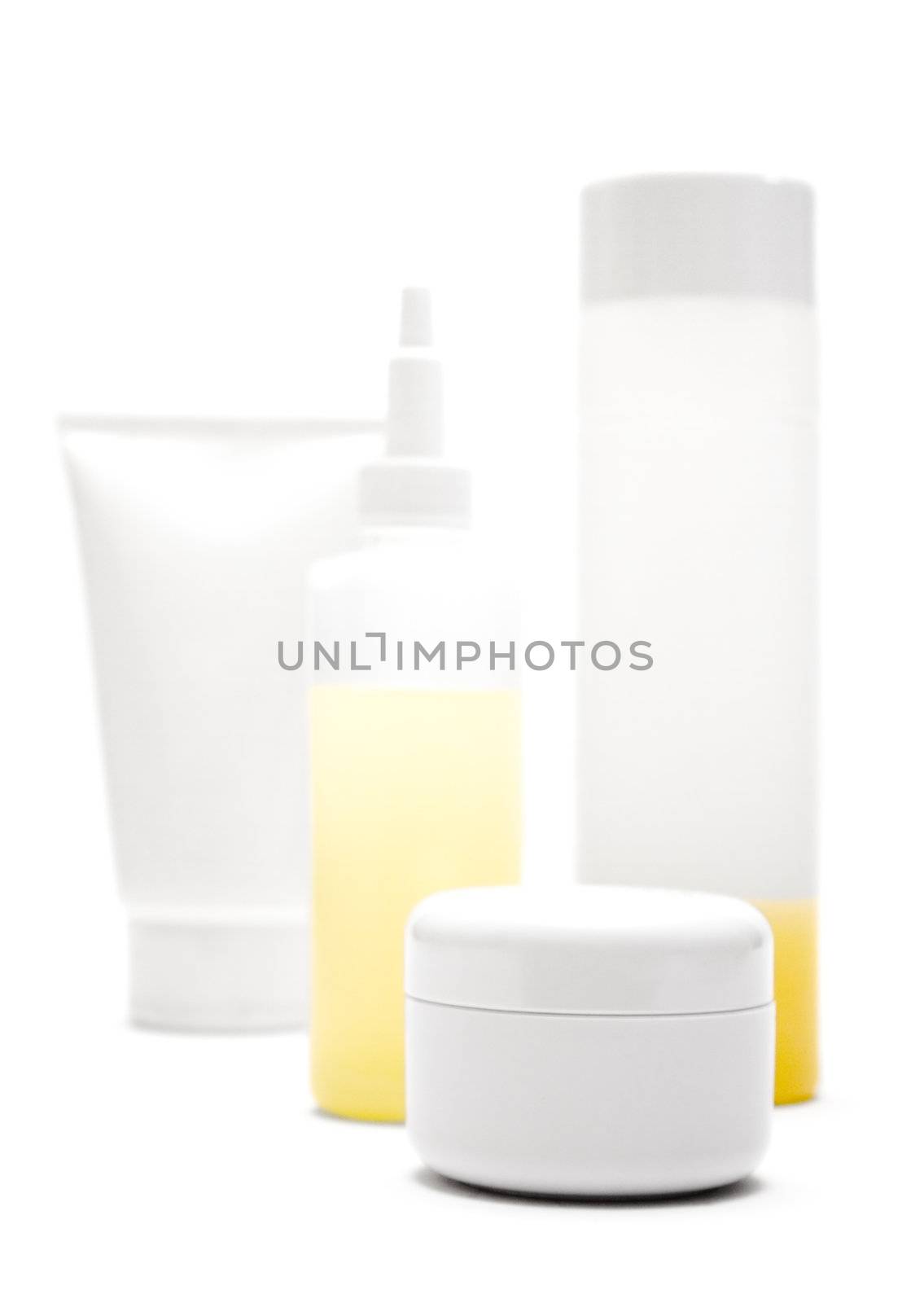 Various blank tubes, bottles and pots isolated on a white background.