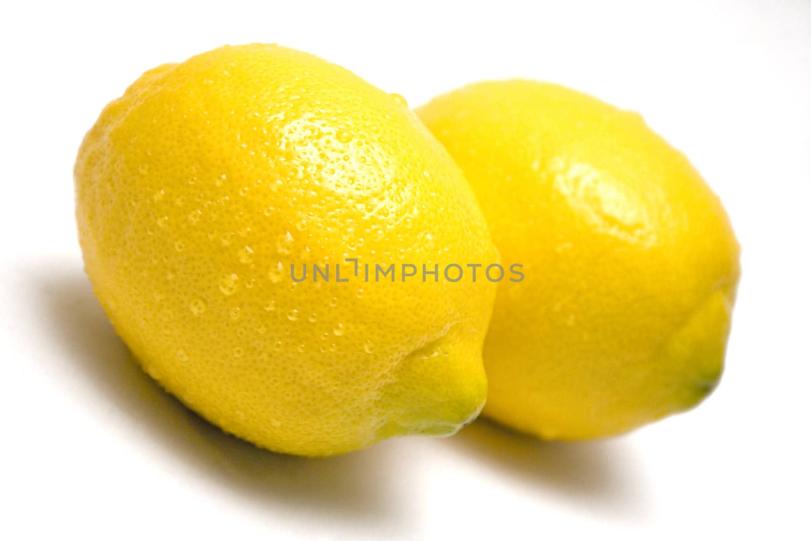 Wet lemons isolated on a white background.