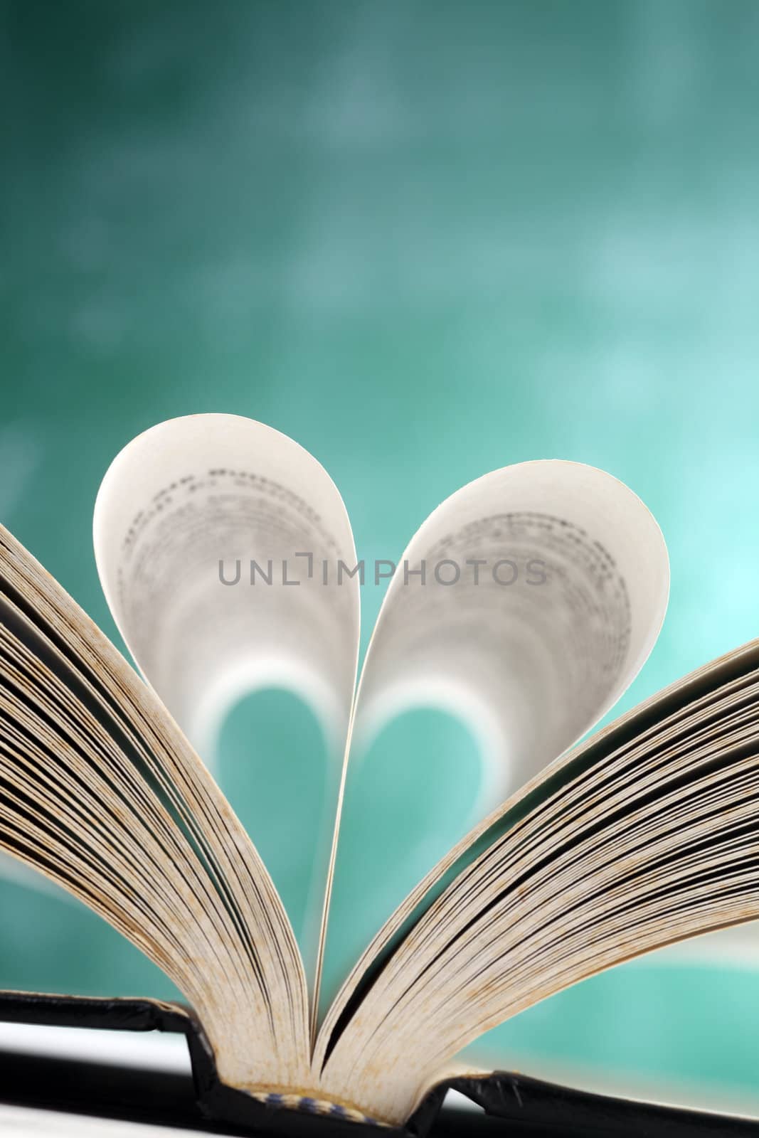 book with open page folded a heart shape