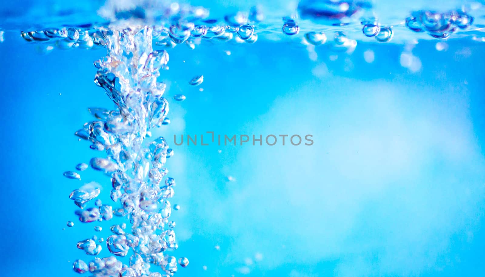 Small water drops in light blue background