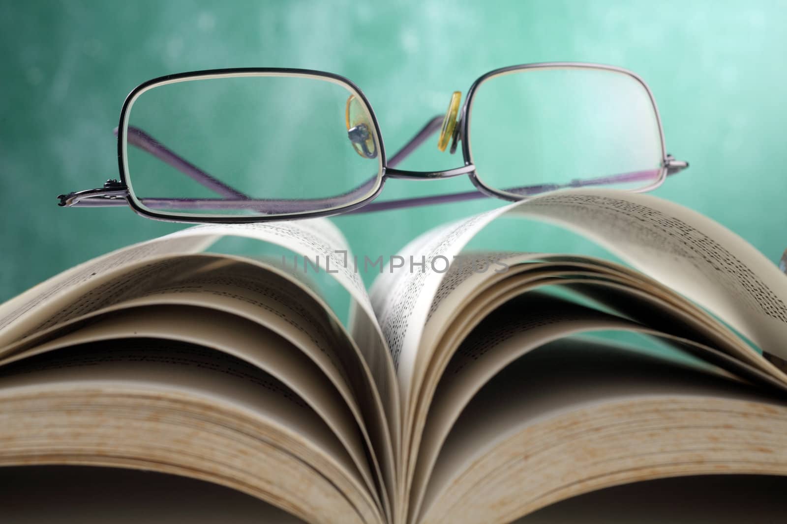 close up of the spectacles on the book