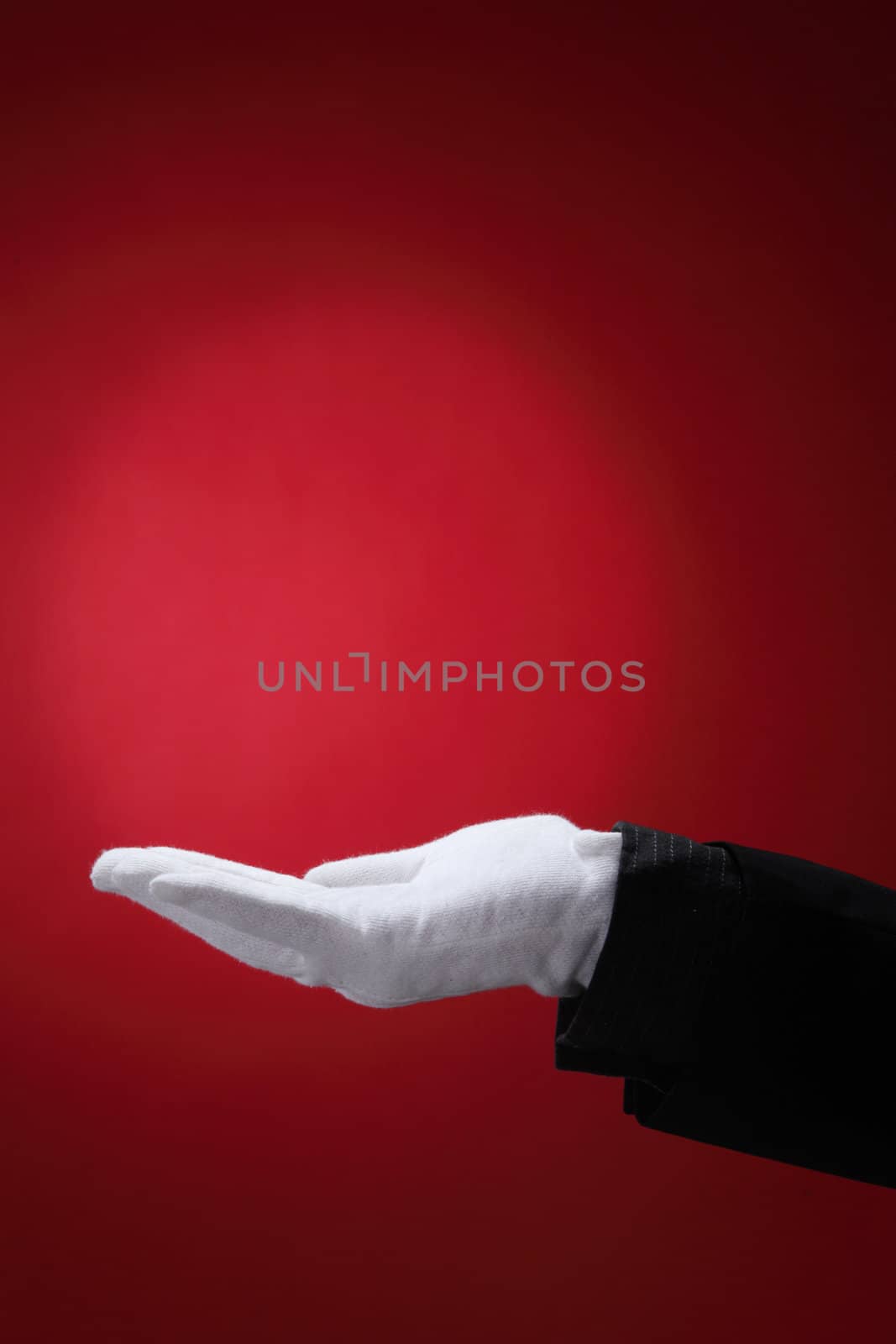 side view of the hand with white glove