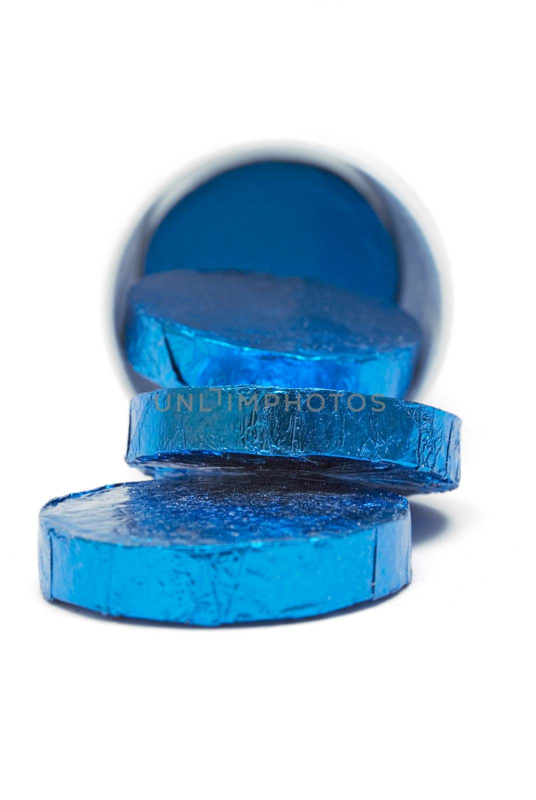 Wrapped pills in a plastic container isolated on a white background.