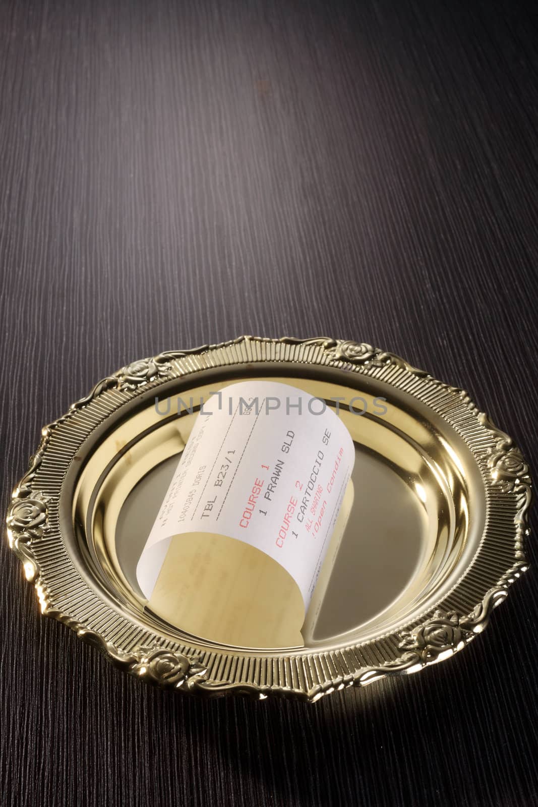 stock image of the curly recipt on the golden plate