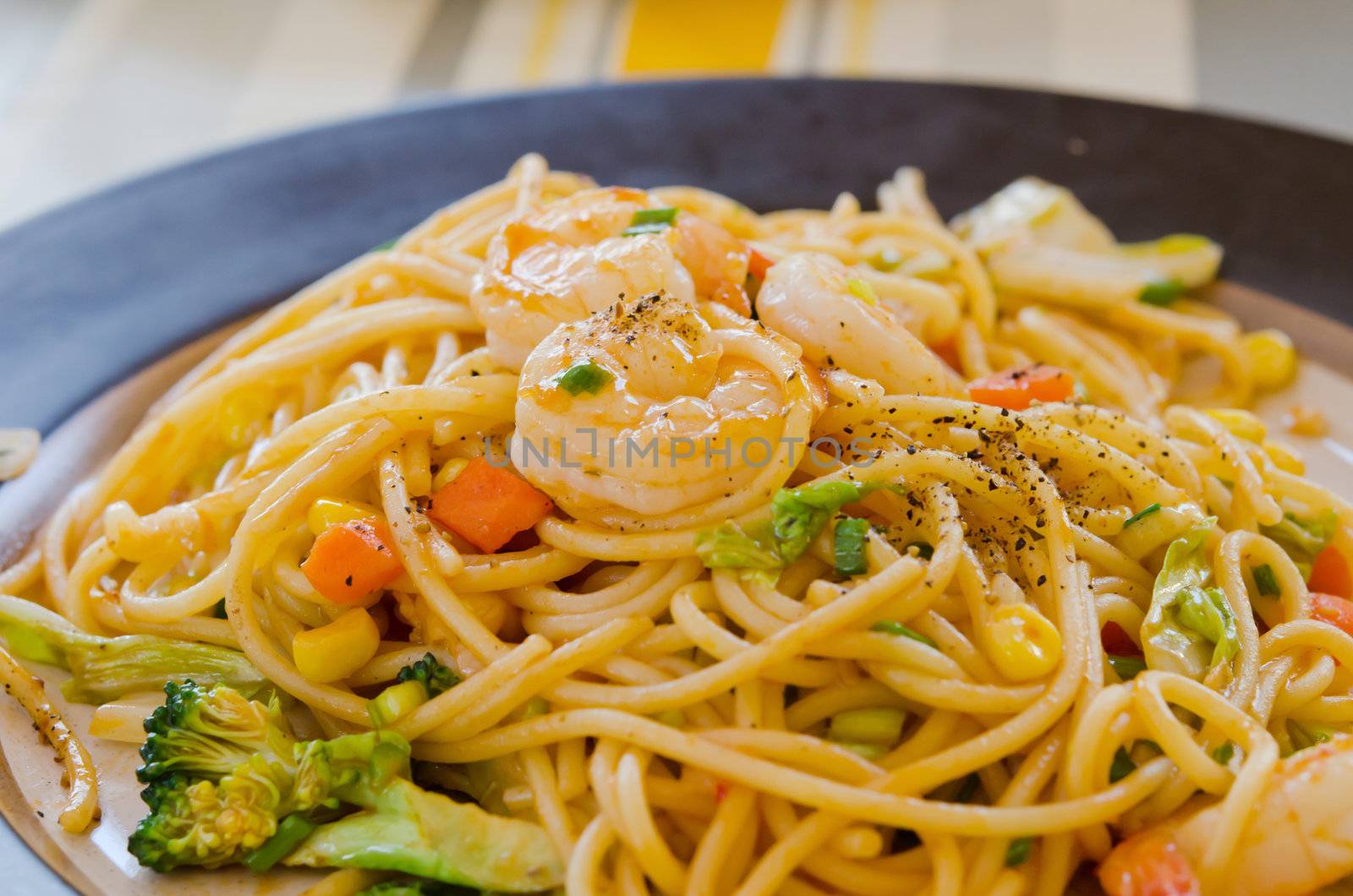 close up  pasta with tomato sauce , shrimp  and vegetable