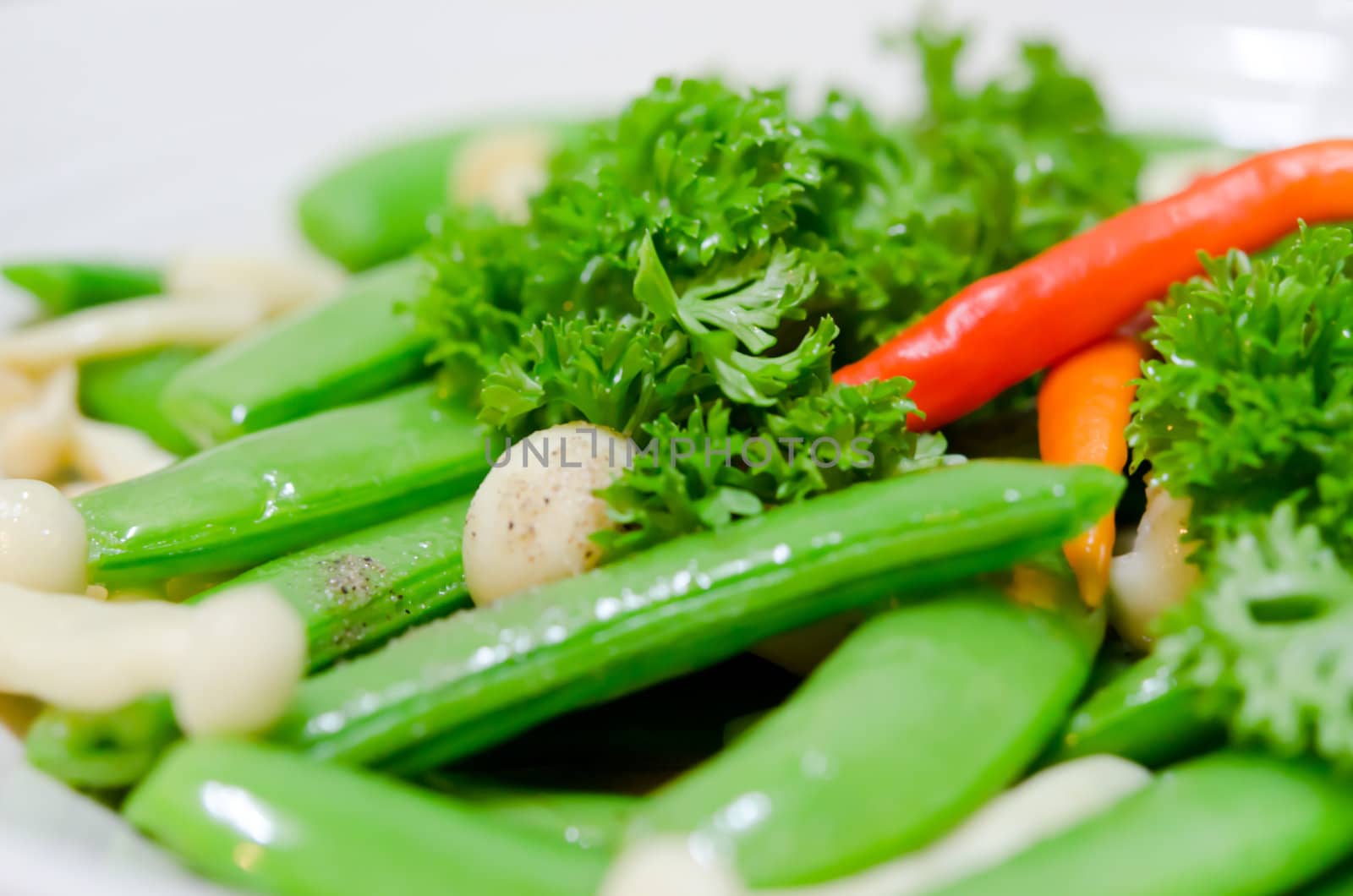 close up stir fried vegetables , pea , chili , parsley  and mushroom