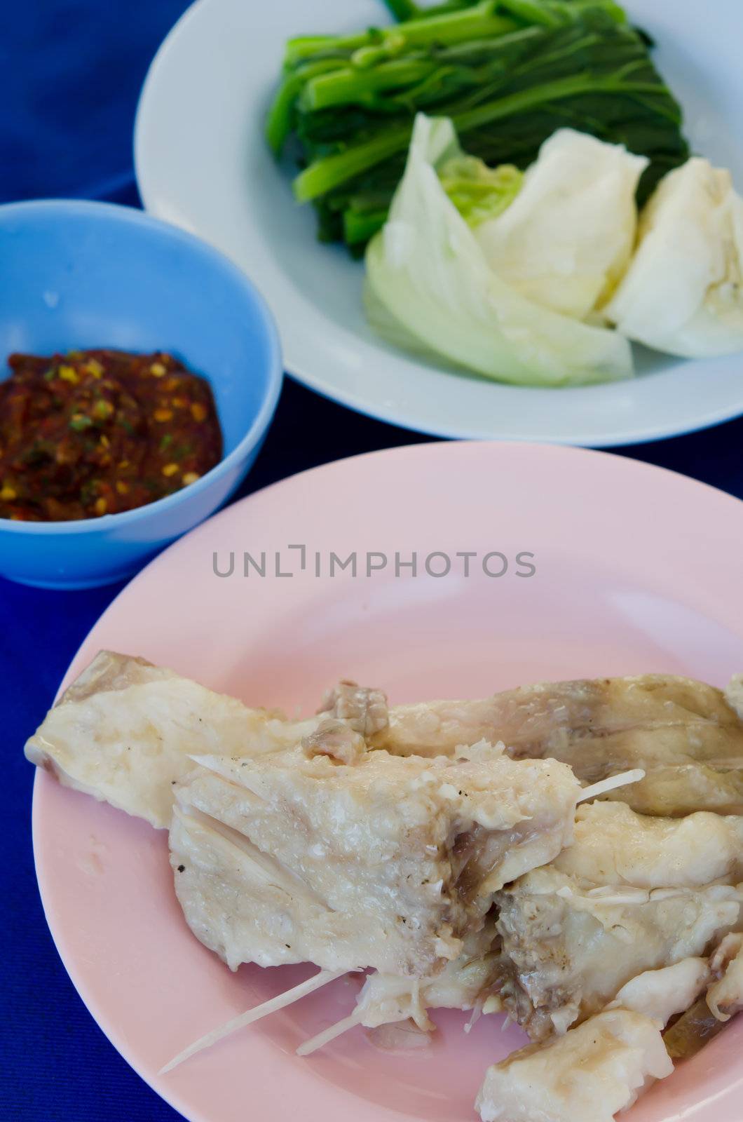 top view  fresh steam fish served with chili sauce and vegetable