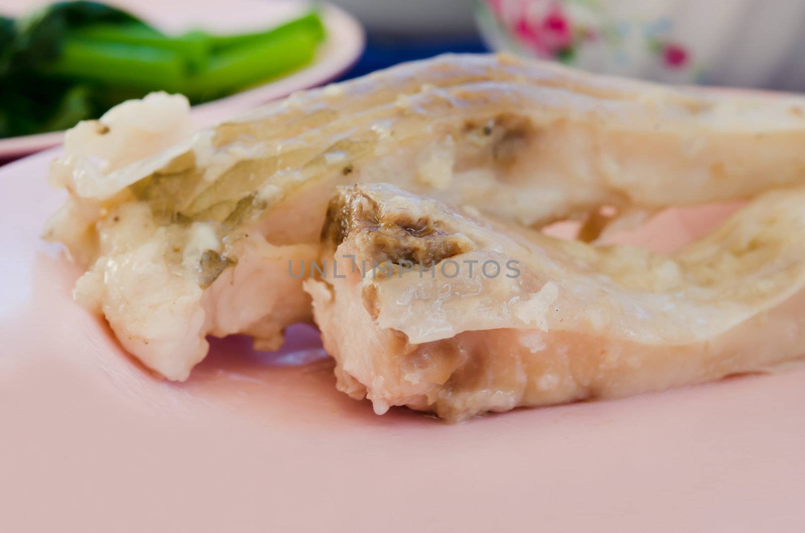 close up  fresh steam fish on pink dish