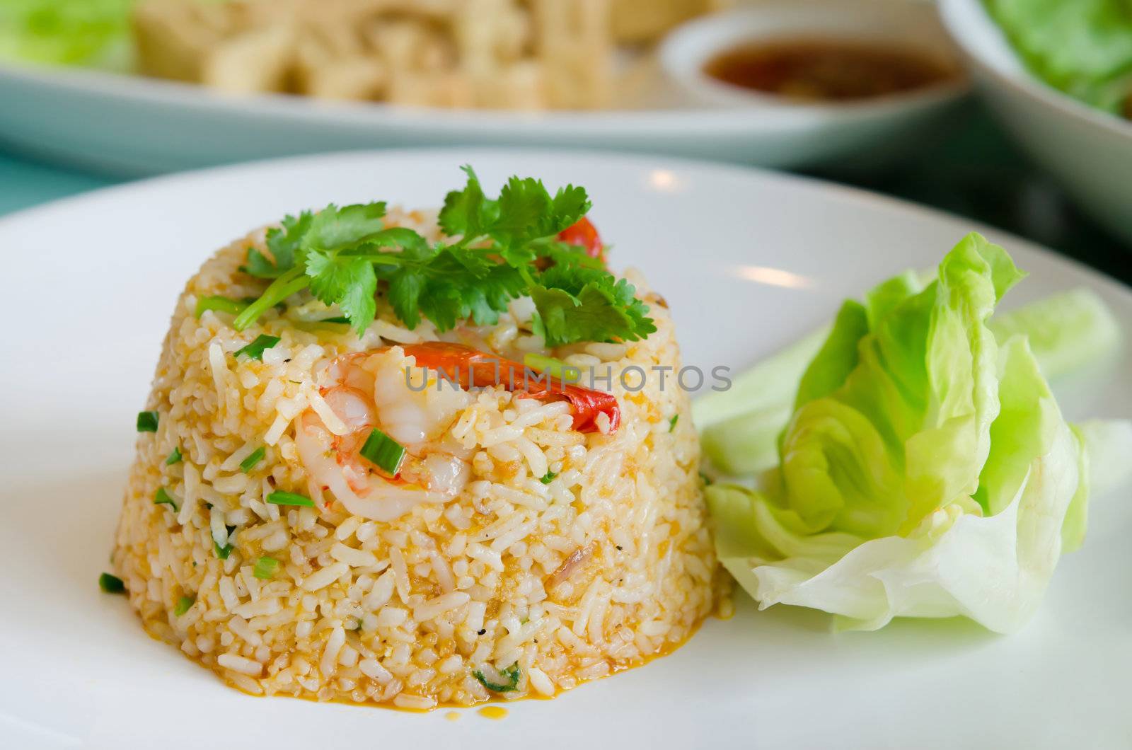 fried rice with  shrimp and vegetable on white plate