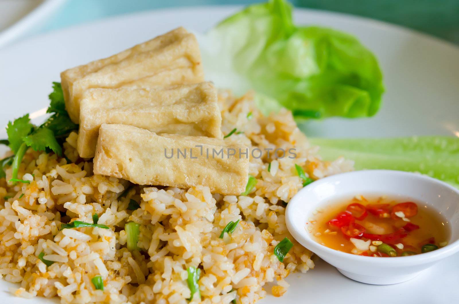 fried rice and fried  tofu served with spicy sauce