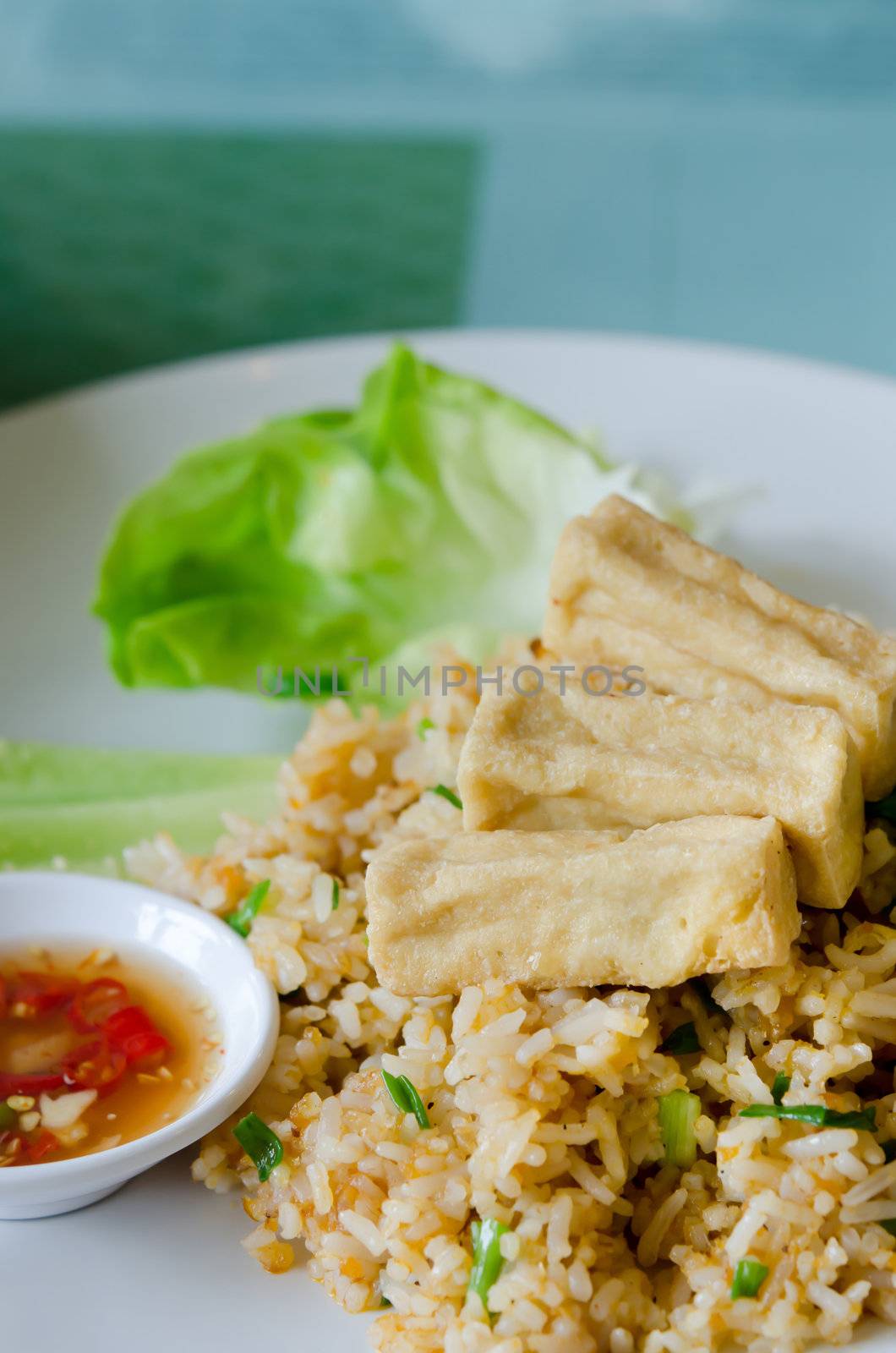 fried rice and fried  tofu served with spicy sauce and fresh vegetable