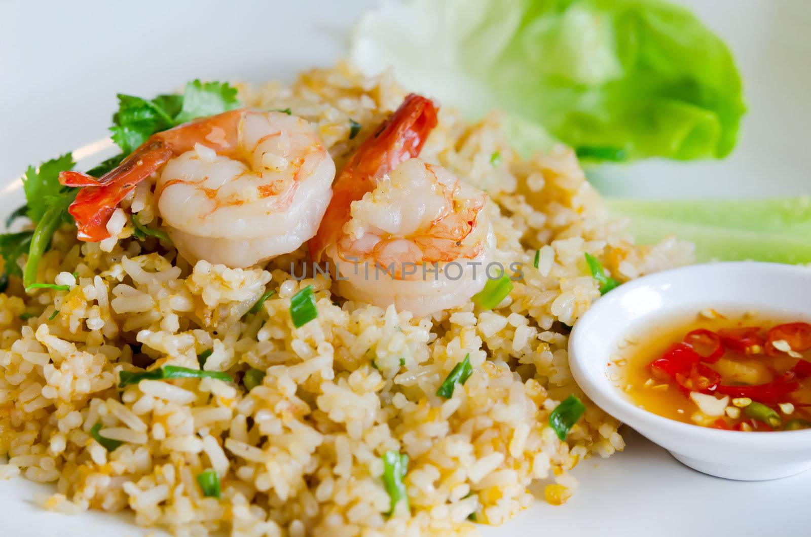 fried rice and shrimp  served with spicy sauce and fresh vegetable