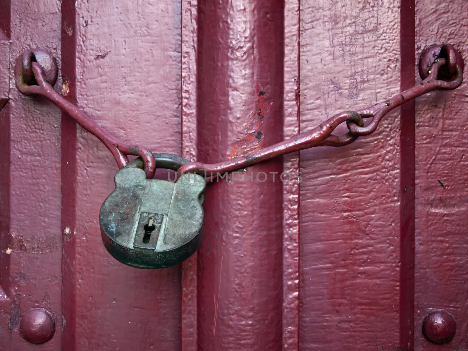 Old Lock Key on Close Red Wood Door