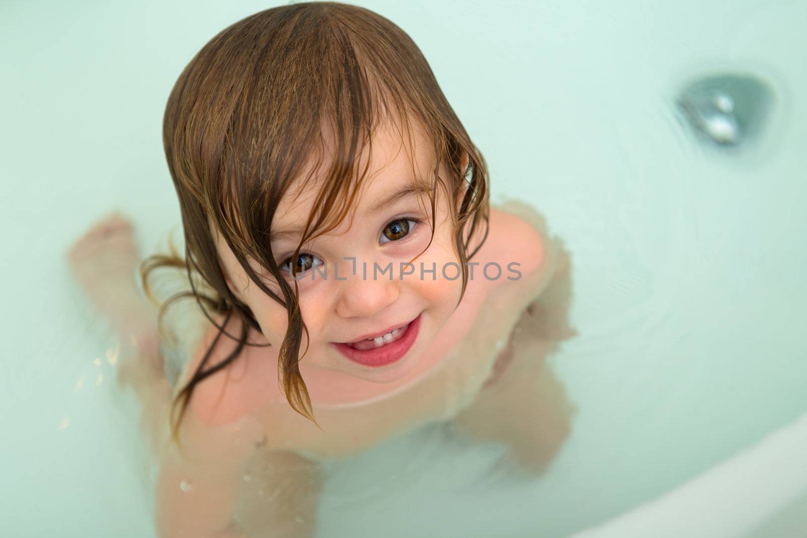 Toddler looking up from the bath tub happily and trustfully, waiting for the soap come.







Waiting for my Soap